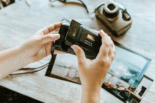 a person holding a camera up to take a picture