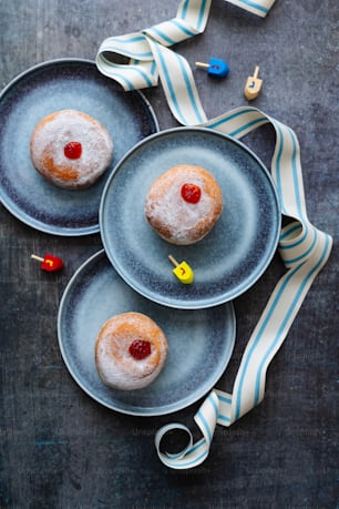 a couple of doughnuts sitting on top of plates