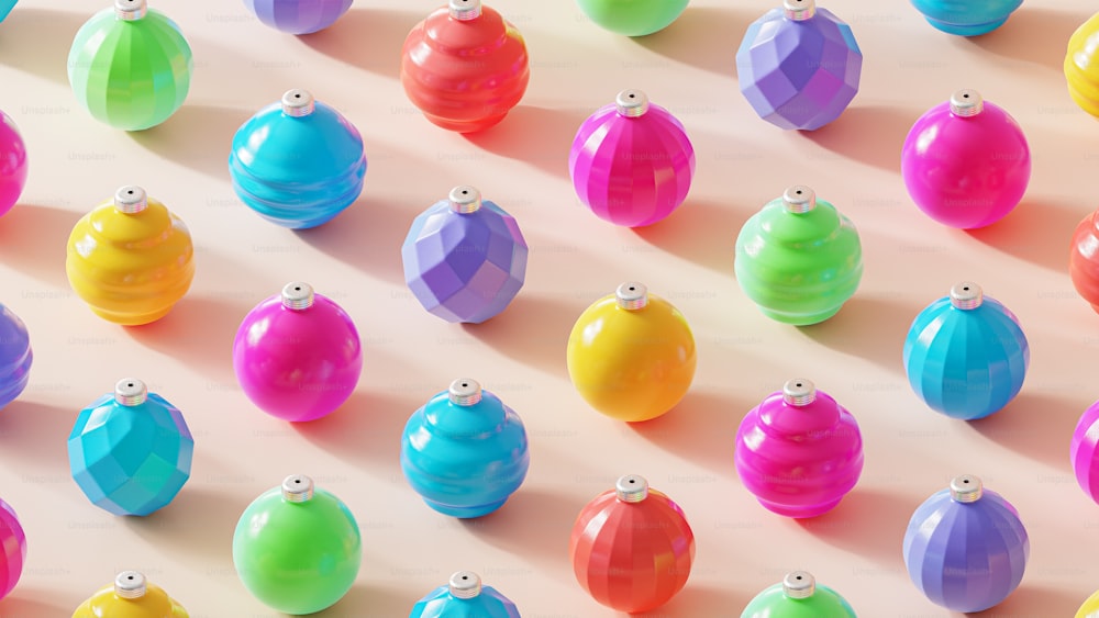a group of multicolored balls on a white surface