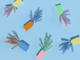 a bunch of different colored papers with plants sticking out of them