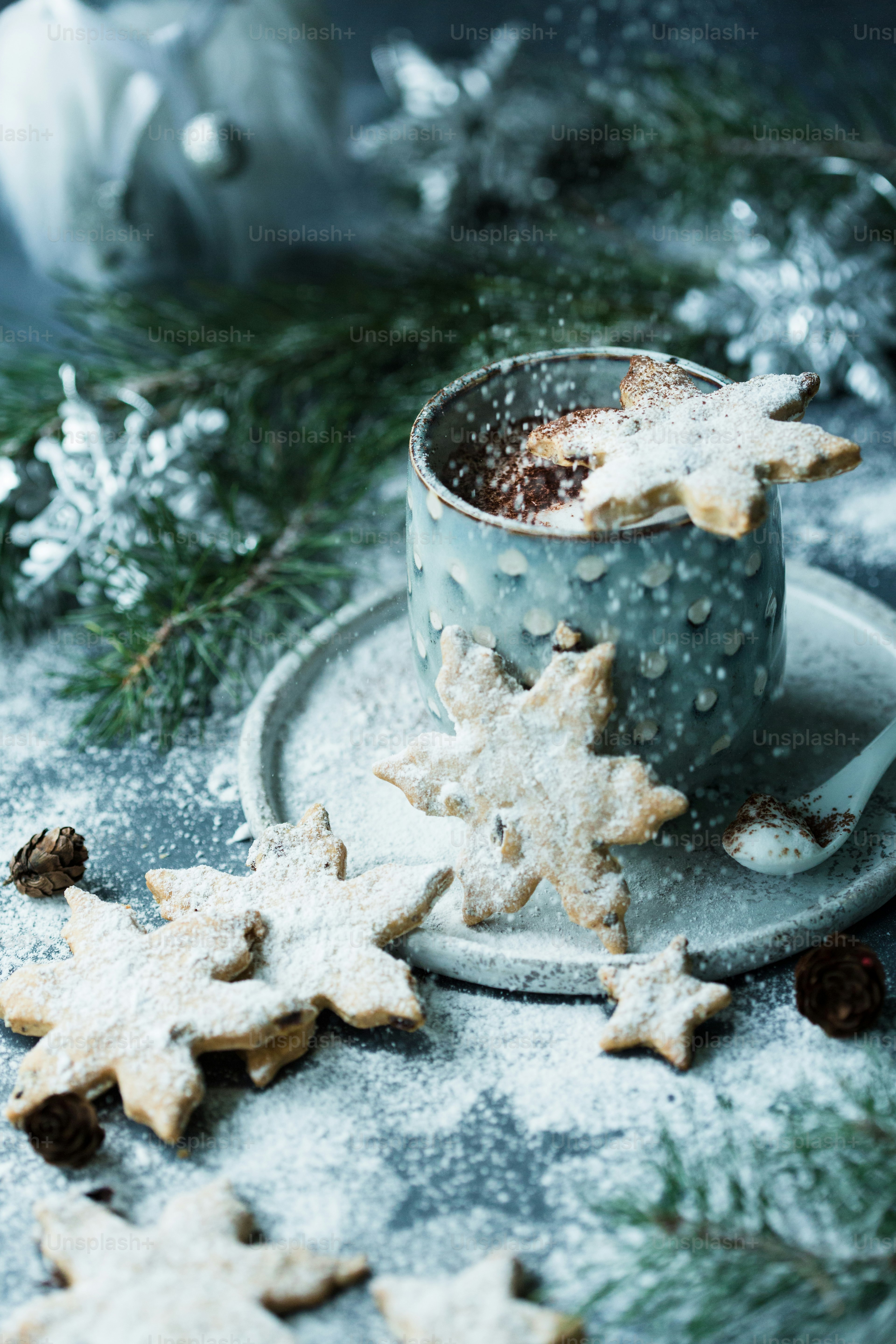 a cup of coffee and some cookies on a plate