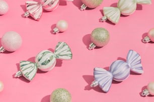 a pink background with many different colored ornaments
