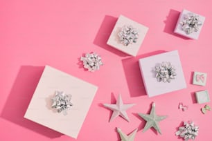 a pink background with white and silver stars