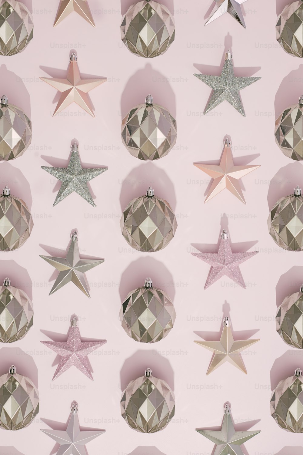 a pink wall with a bunch of shiny stars on it