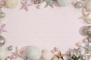a pink background with christmas ornaments and stars
