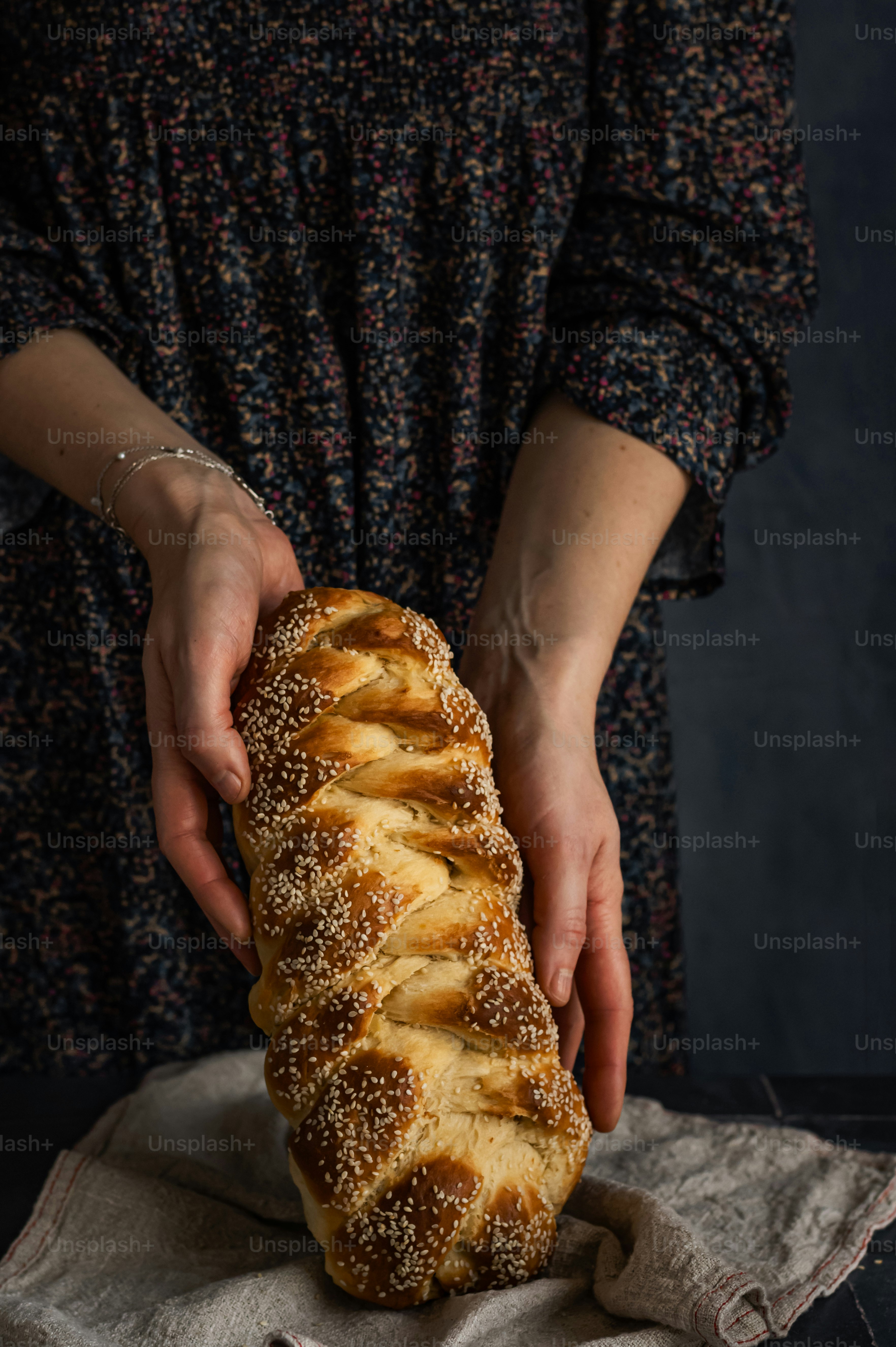 a person holding a pastry in their hands