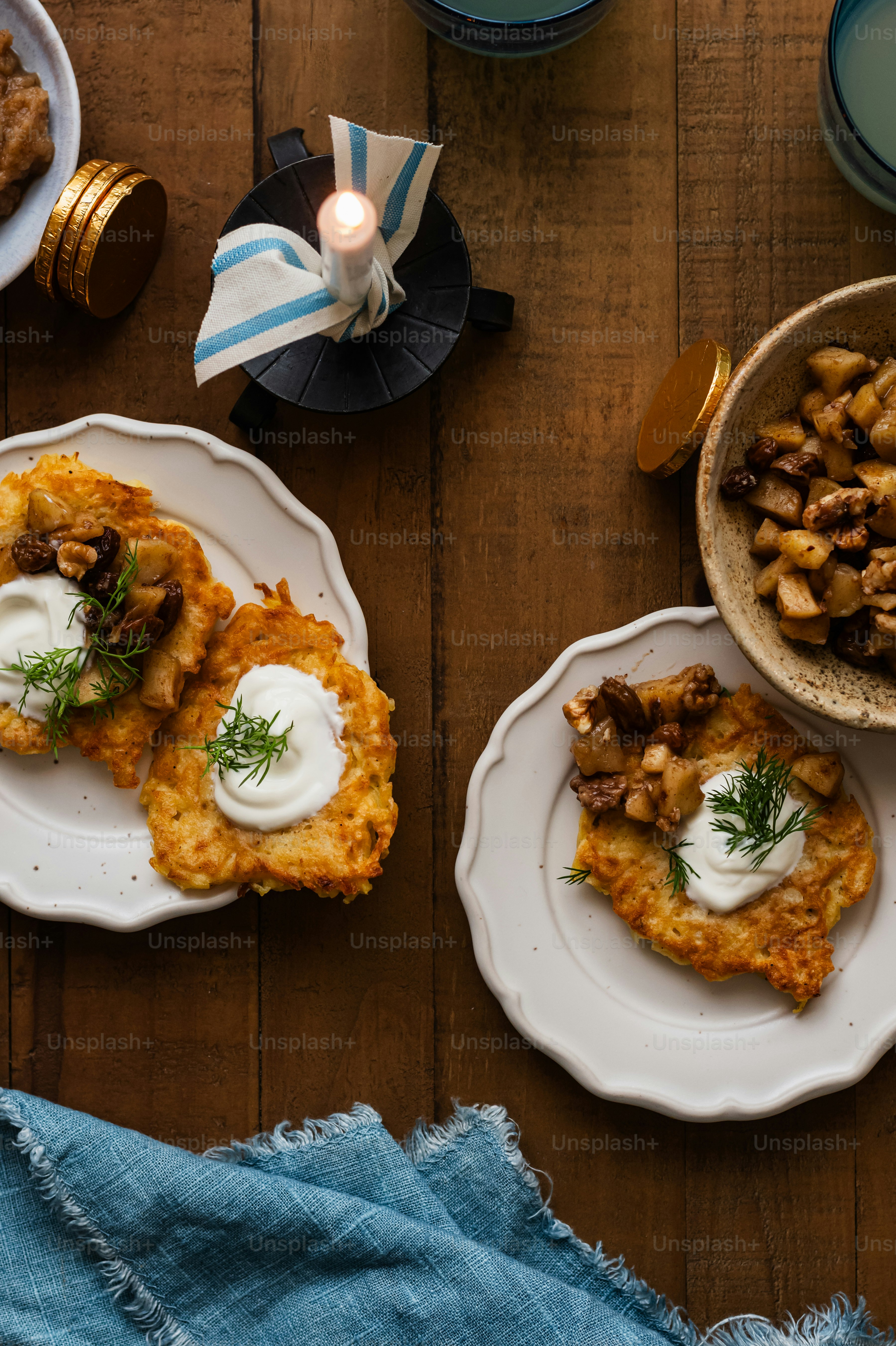 a wooden table topped with plates of food