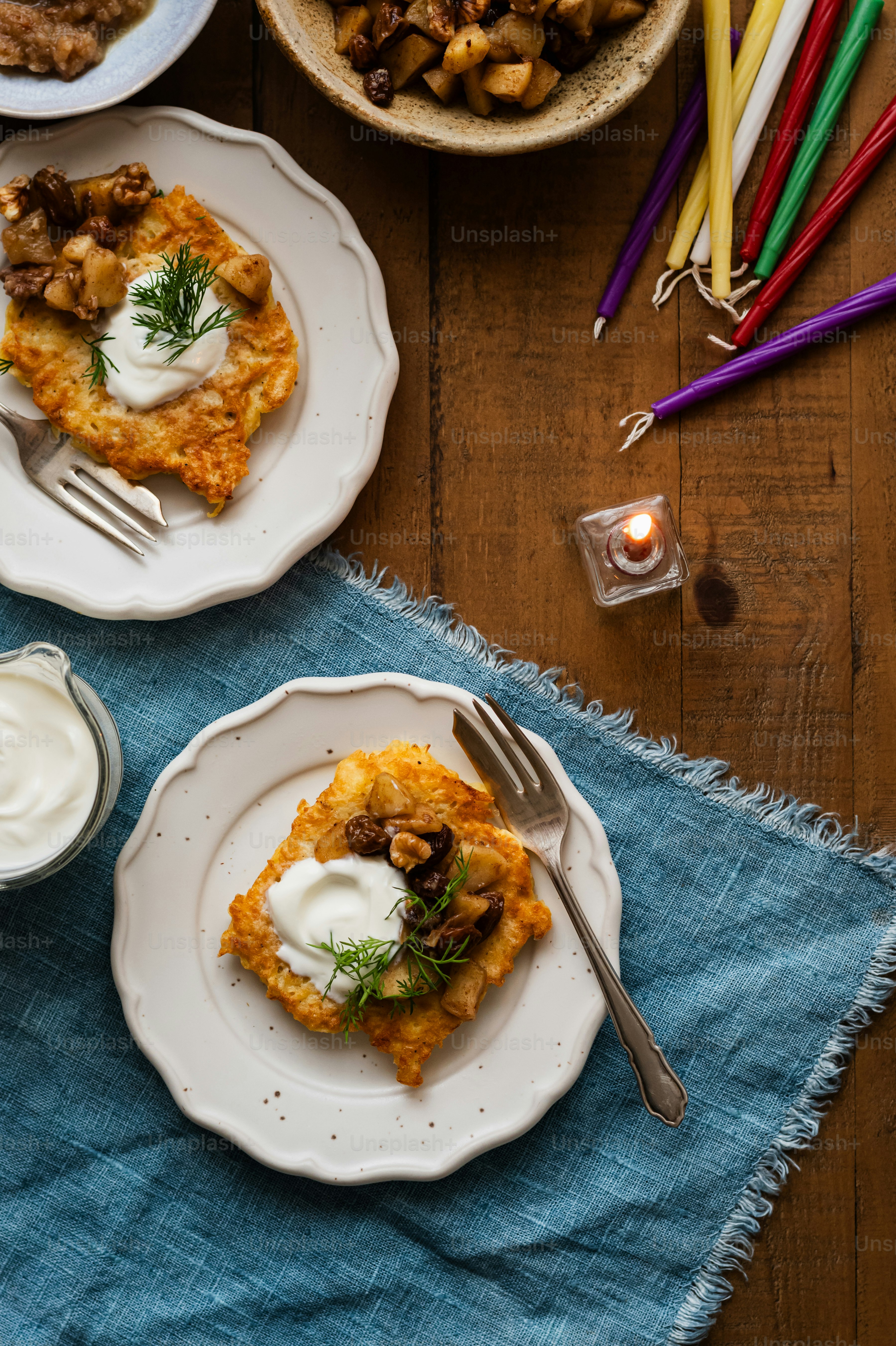 two plates of food on a wooden table