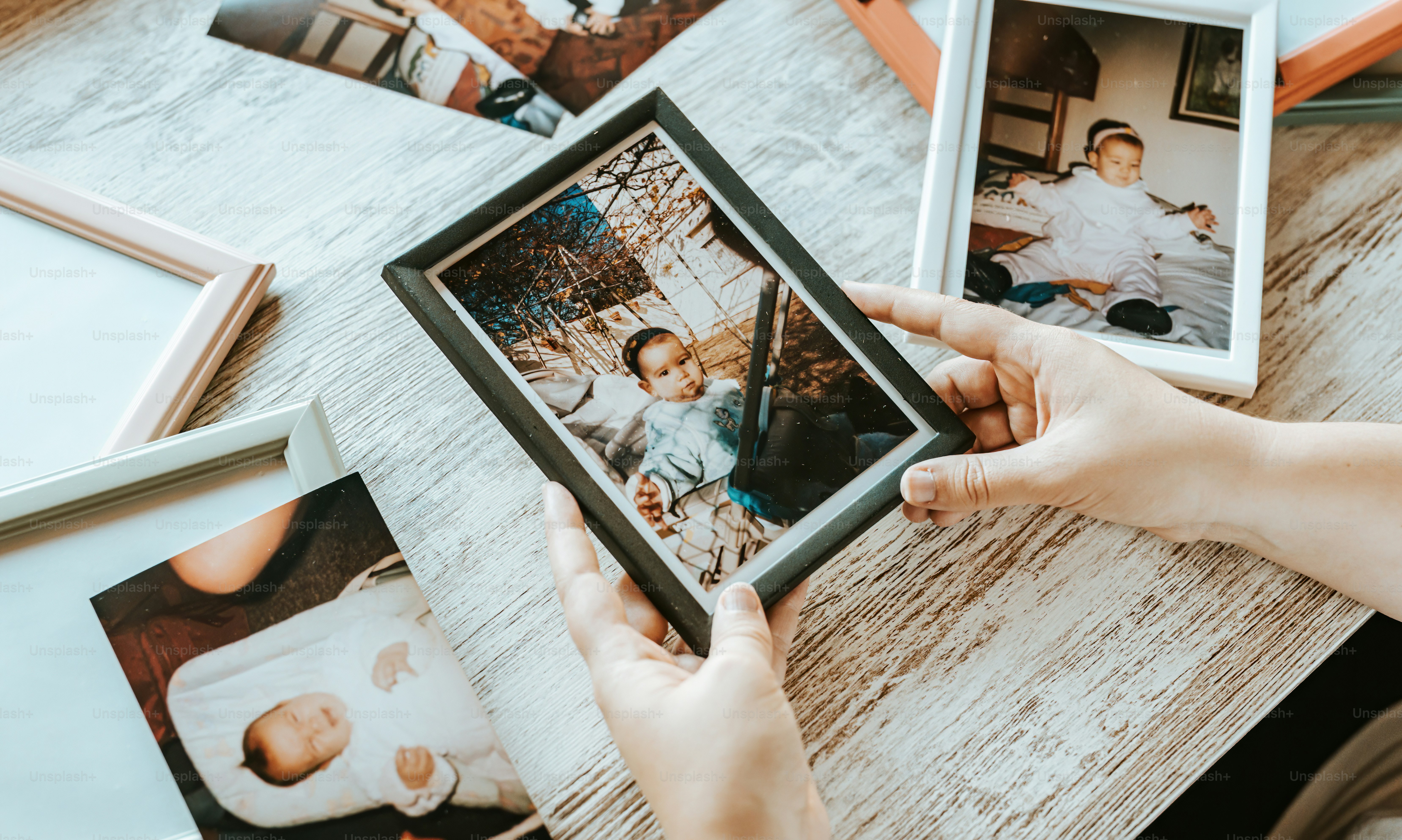 a person holding a picture of a family