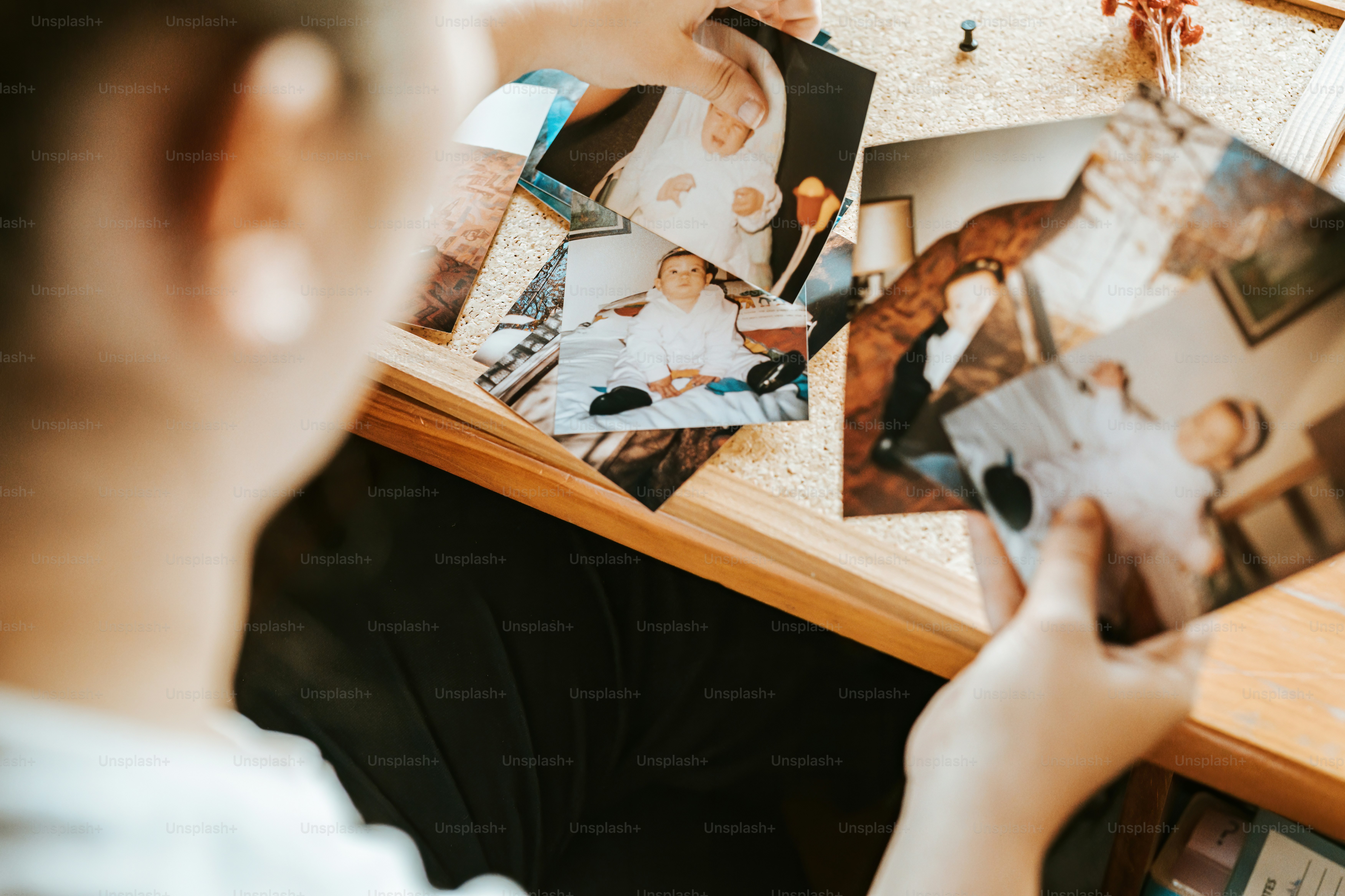 a person holding up a picture of a family