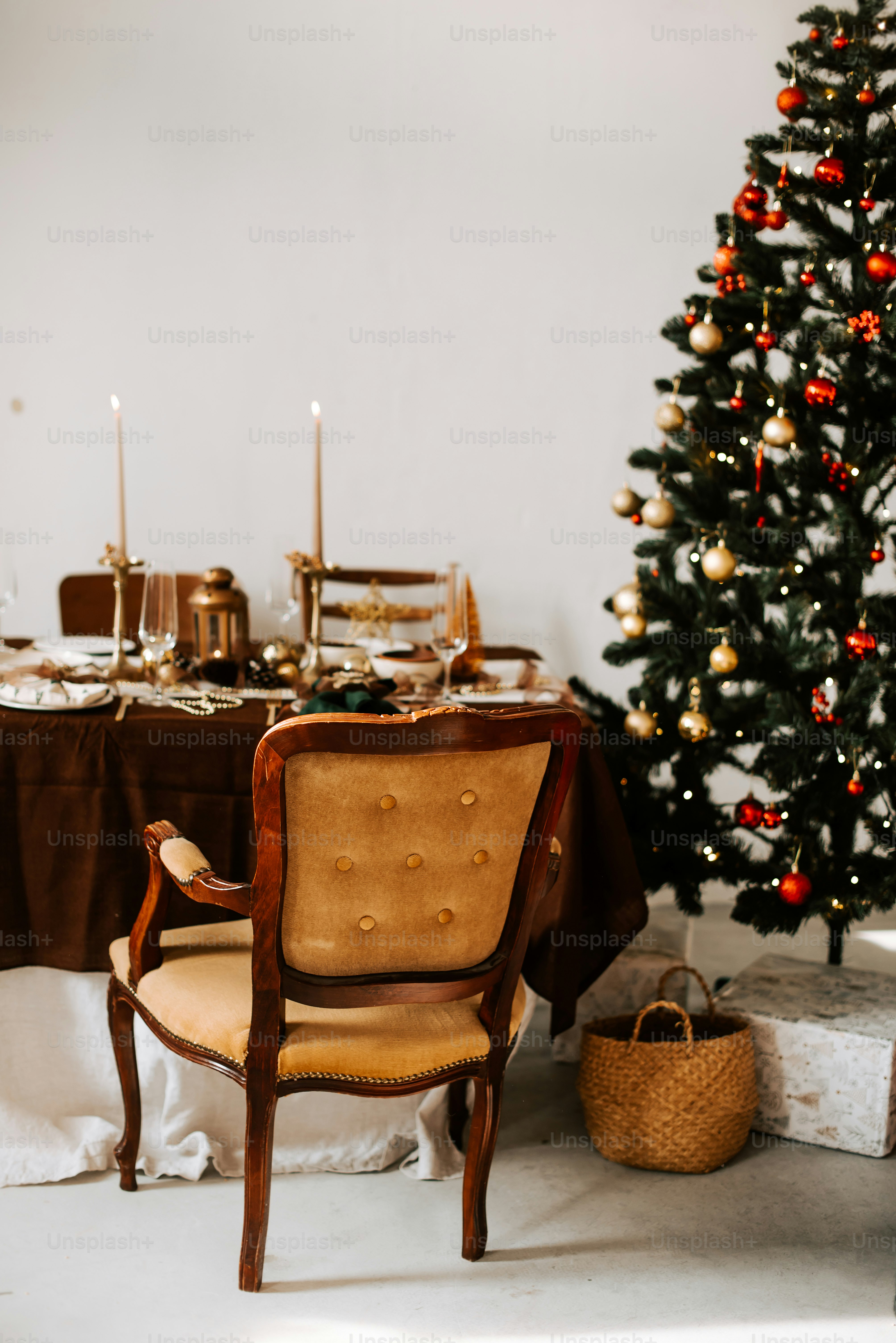A dining room table with a christmas tree in the corner photo ...
