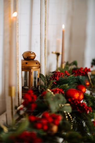 a christmas scene with a candle and a lantern