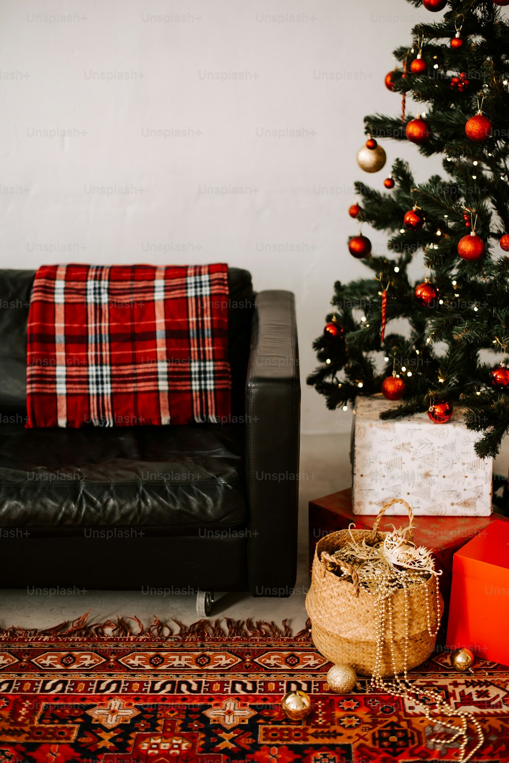 a living room with a christmas tree and a couch