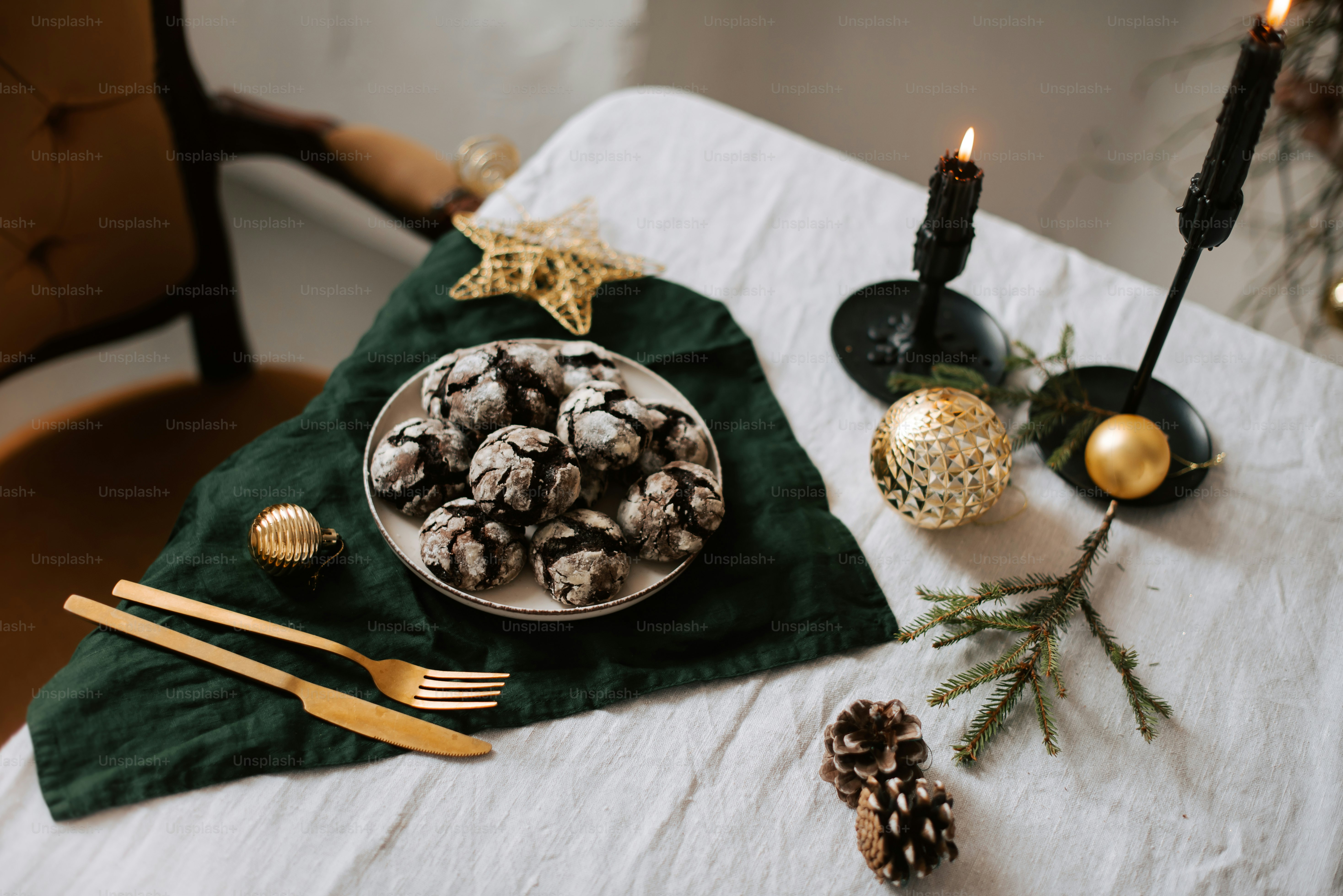 a white table topped with a plate of cookies