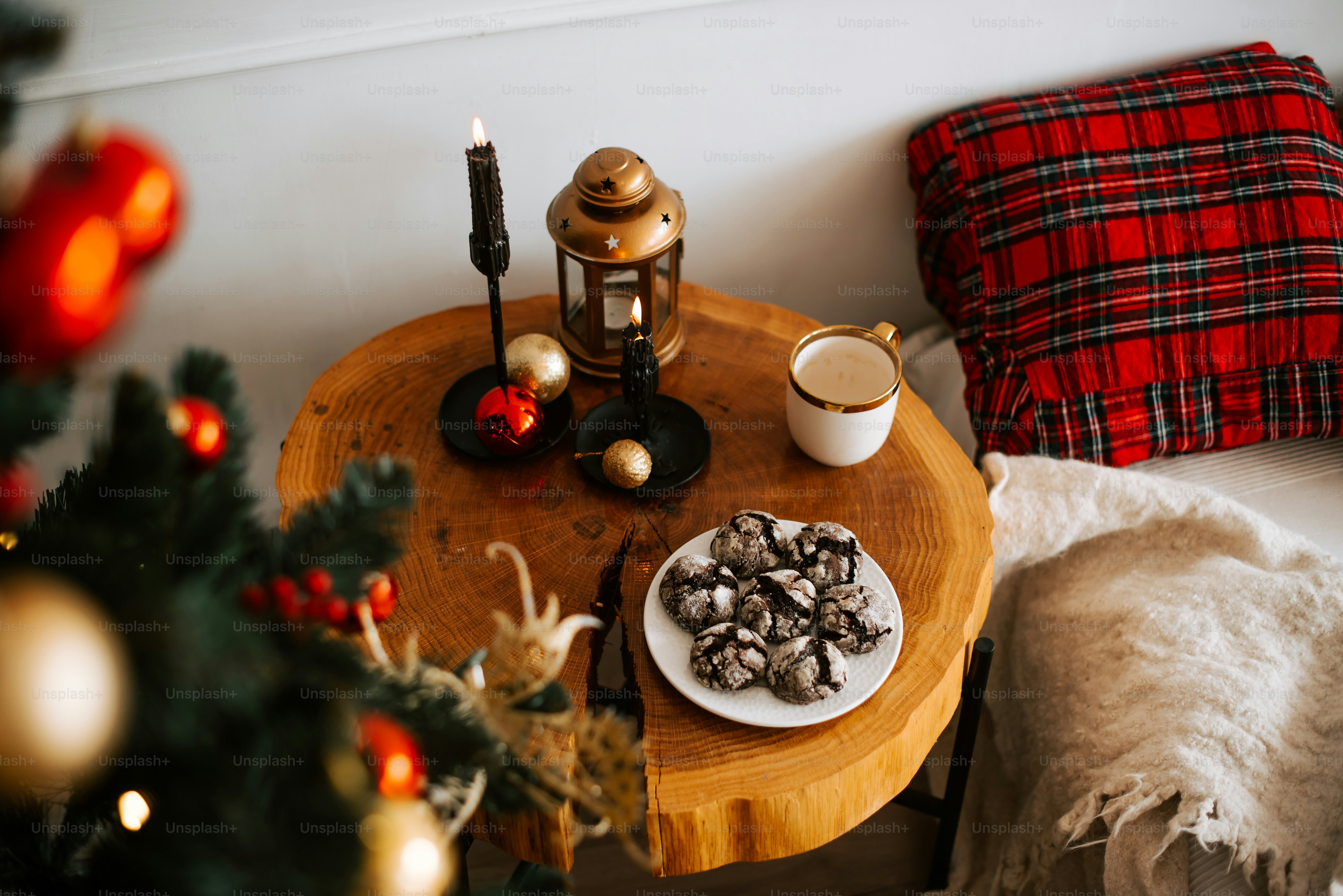 a table with a plate of cookies and a cup of coffee