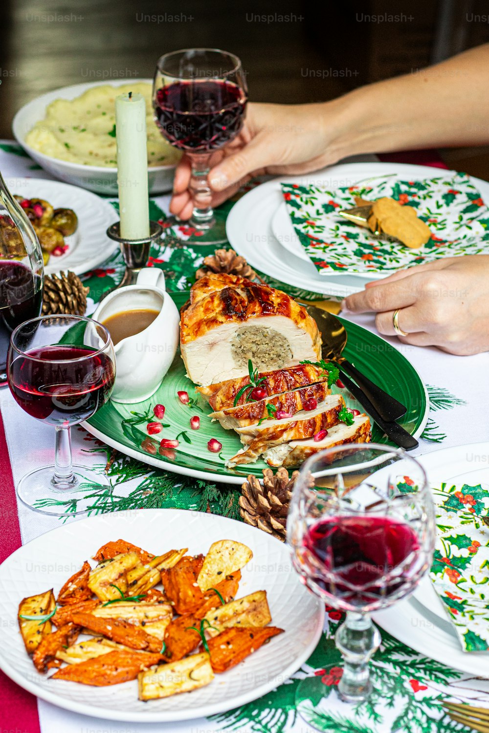 a table topped with plates of food and glasses of wine