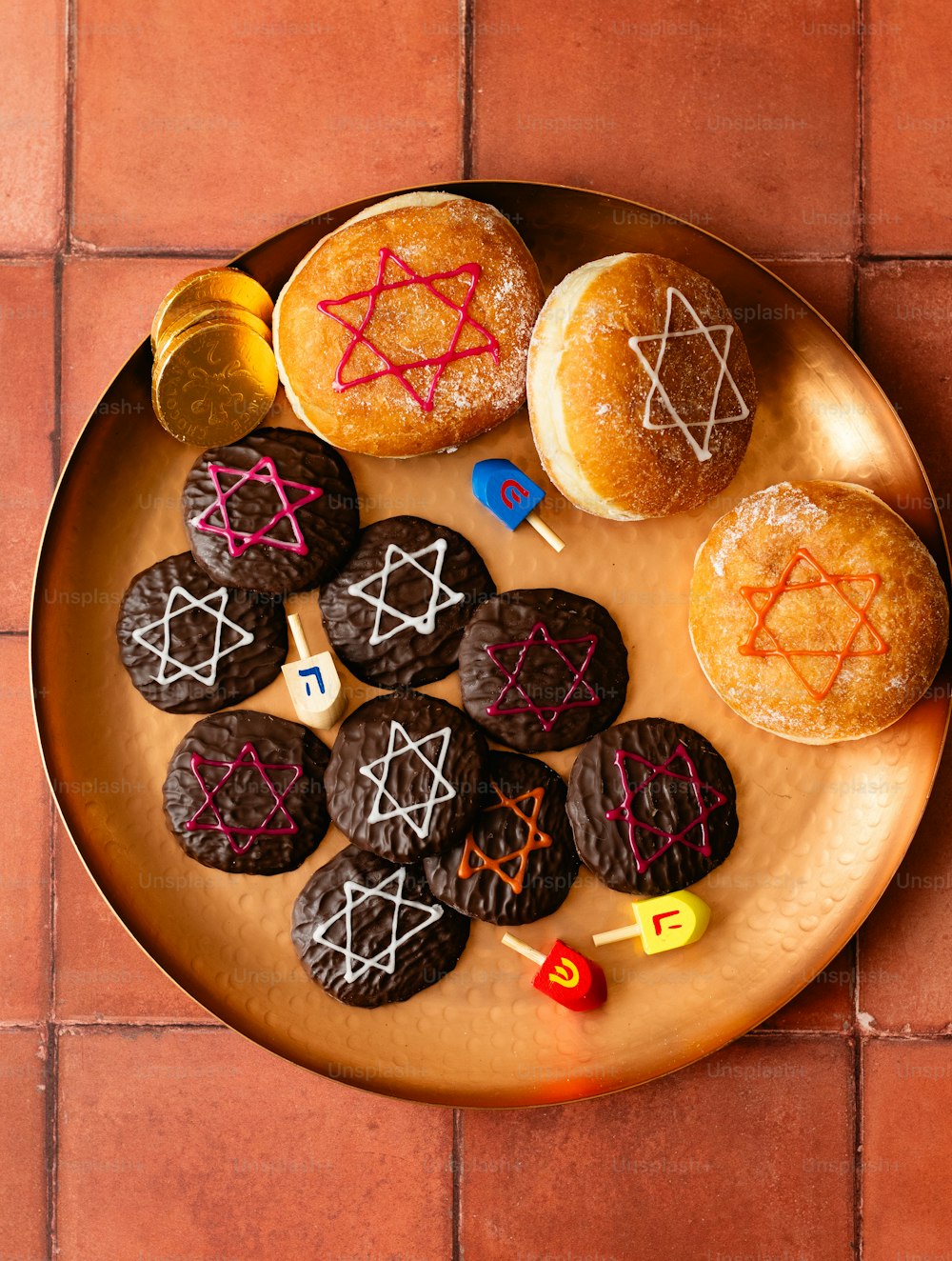 a plate of cookies with symbols on them