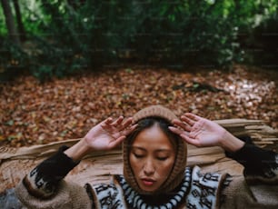 a woman with her hands on her head