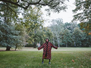 a person in a costume standing in a field