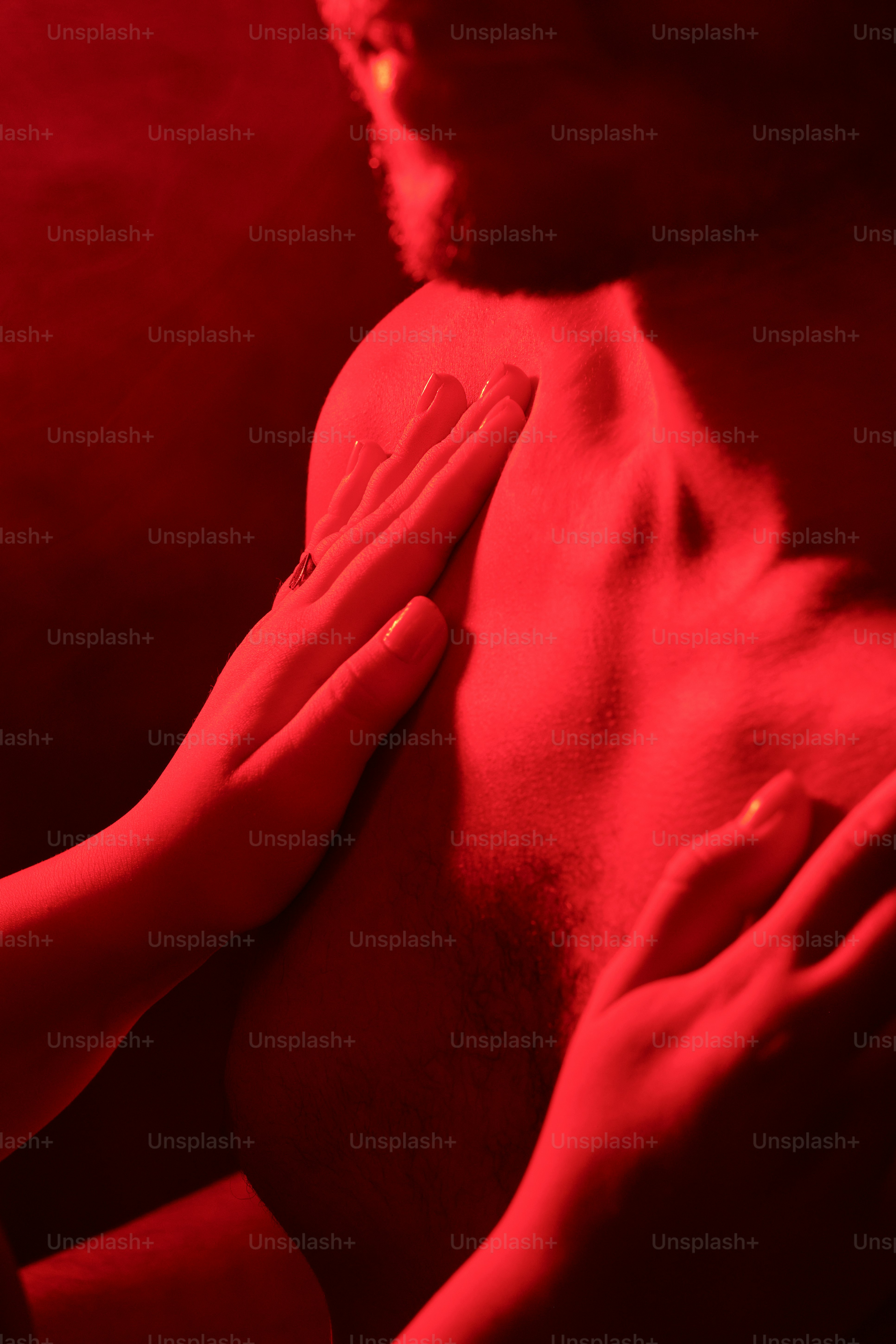 a man with his hands on his chest