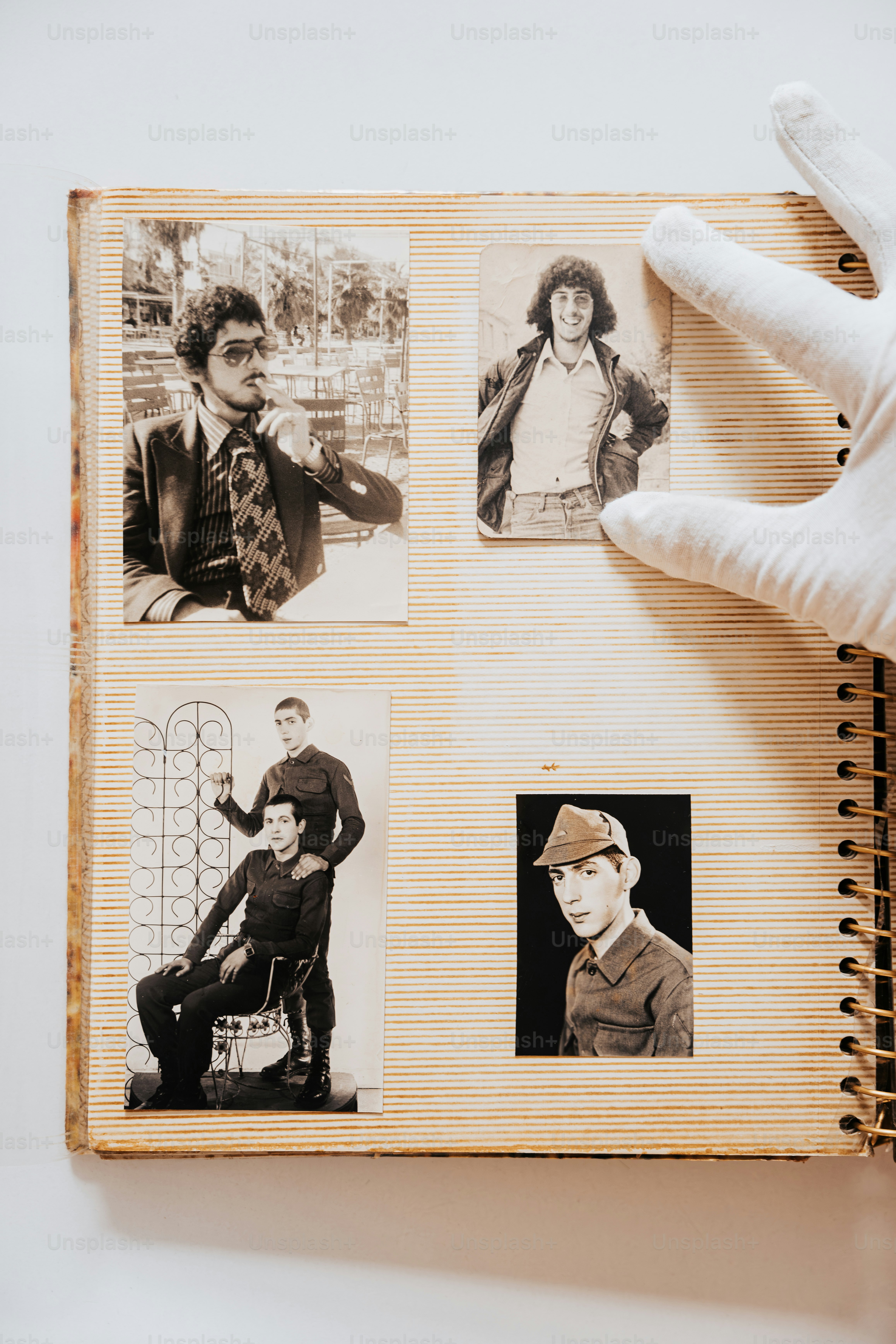 a person holding a book with pictures of people on it