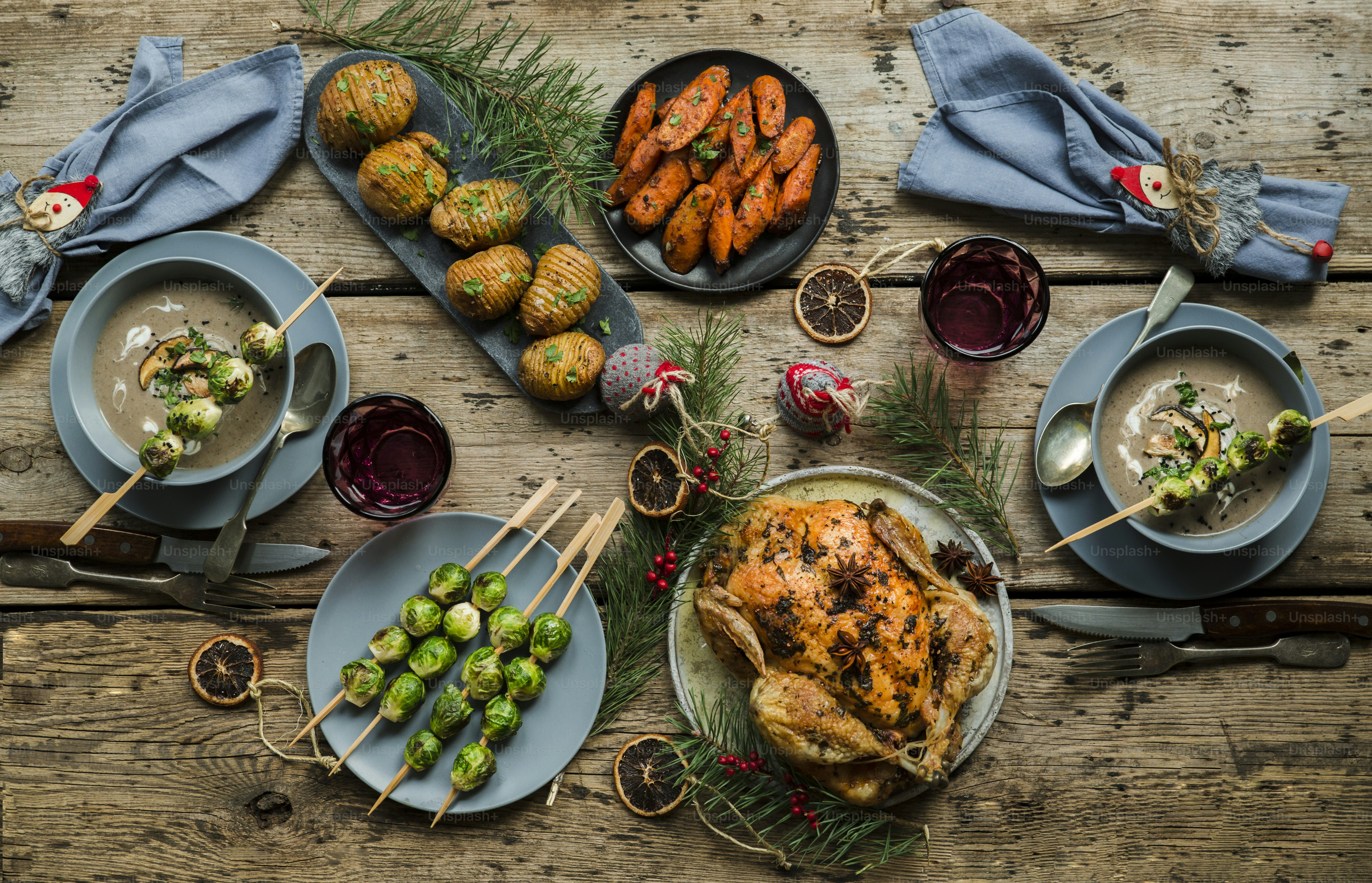 a wooden table topped with plates of food