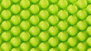 a large group of green balls are arranged in a pattern