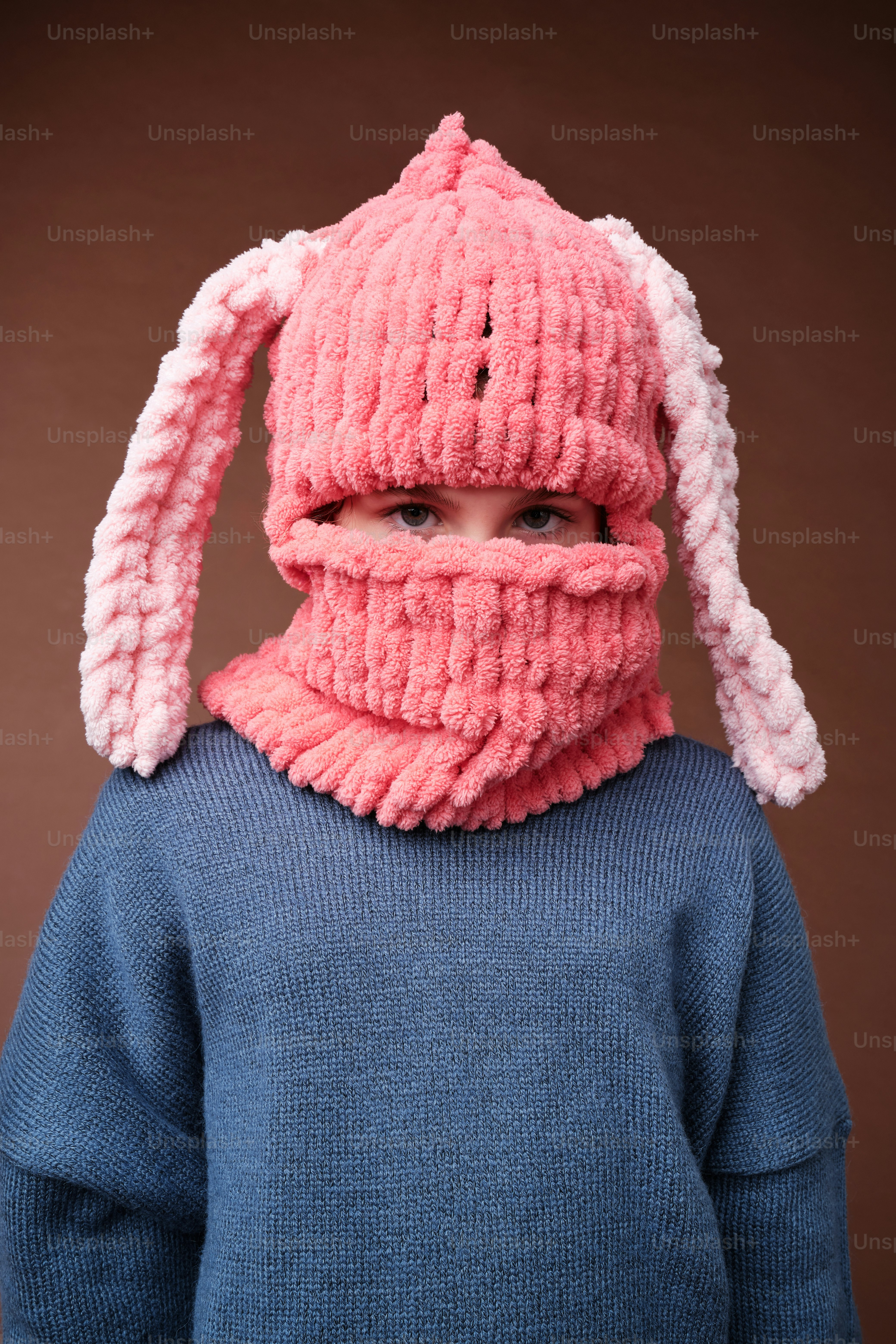 A young child wearing a knitted bunny hat and scarf photo – Fashion ...