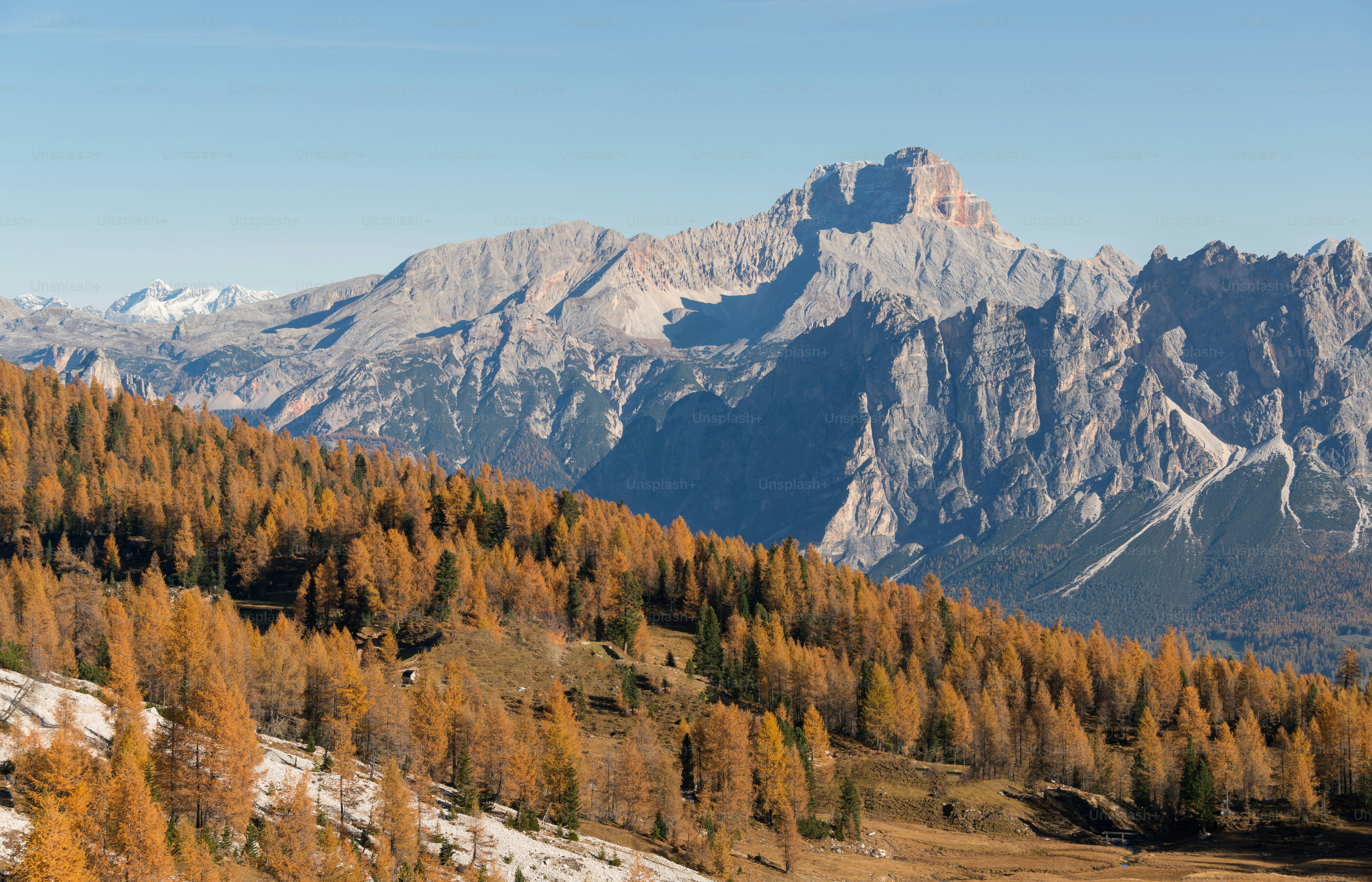 The sun is shining over a mountain lake photo – Land Image on Unsplash