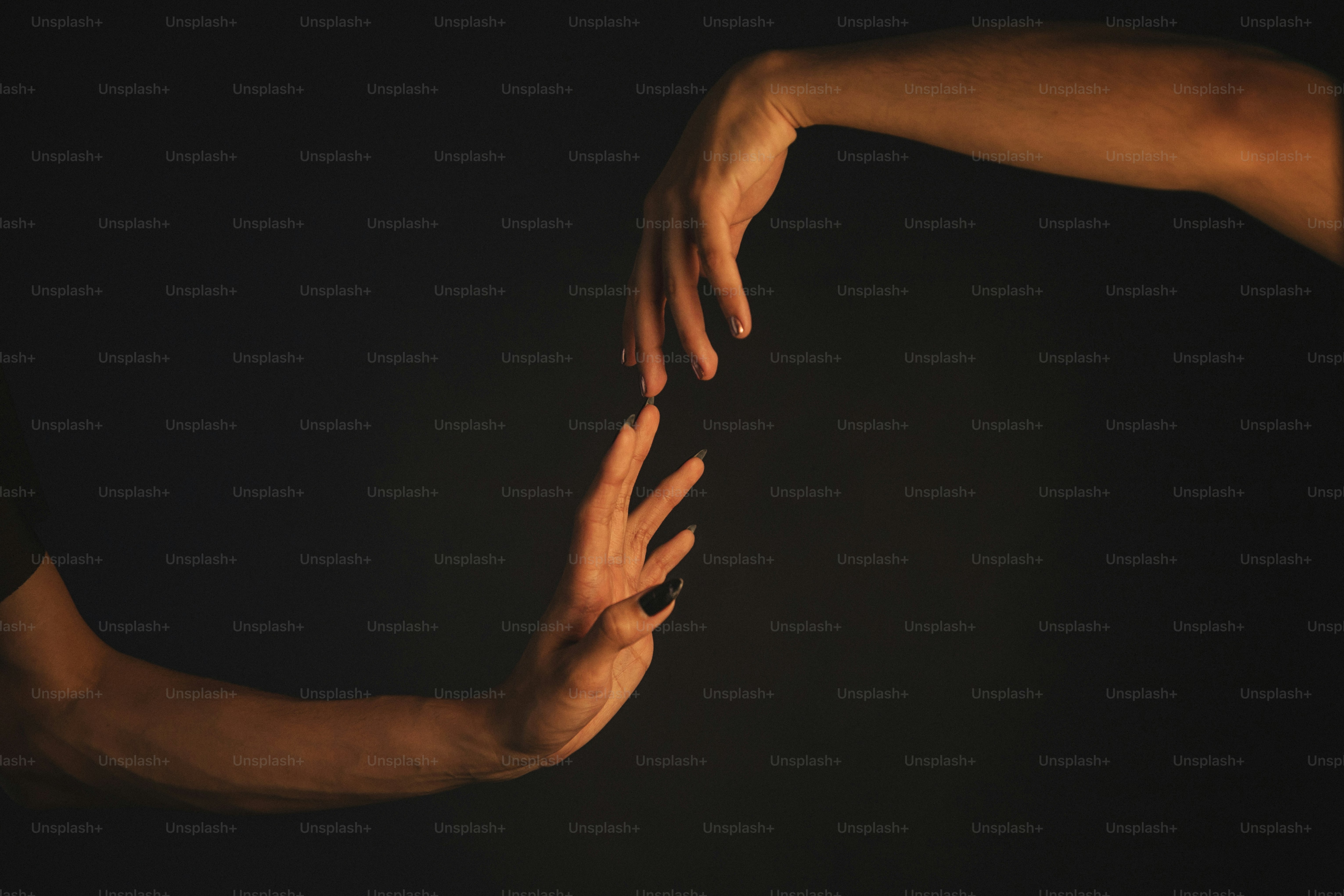 Two hands reaching towards each other in the dark photo – Romantic ...