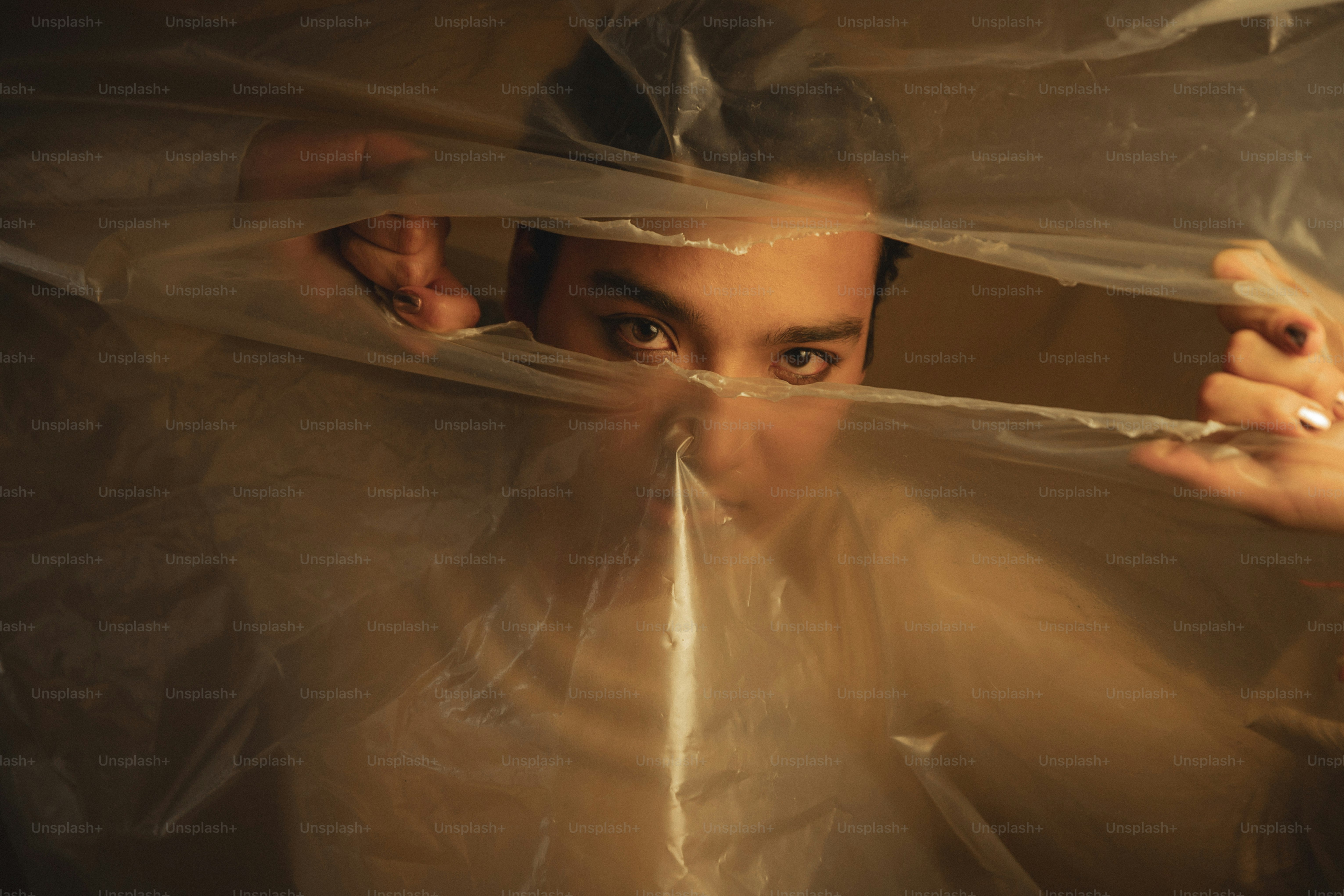 a man holding a plastic bag over his face