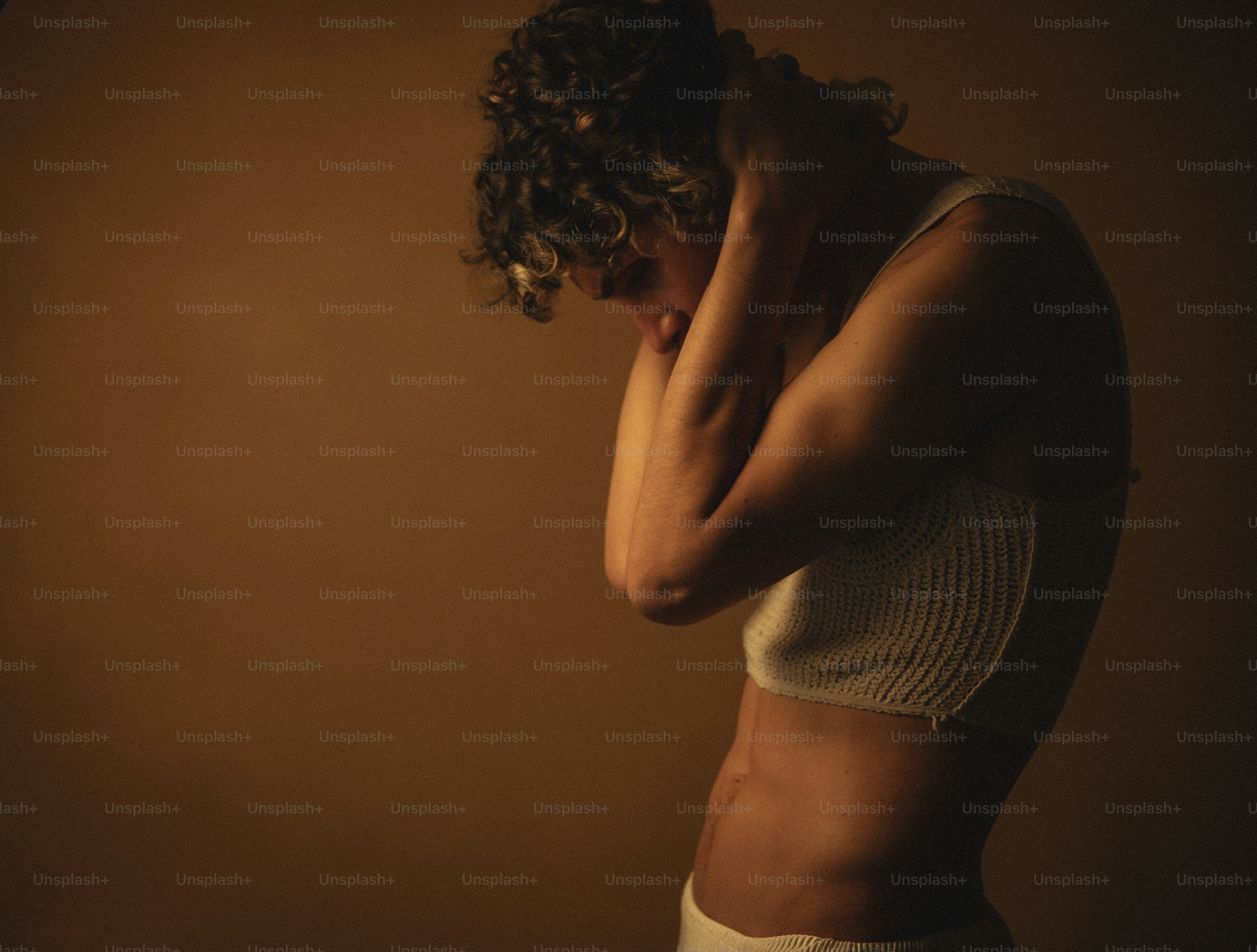 a woman with her hands on her face