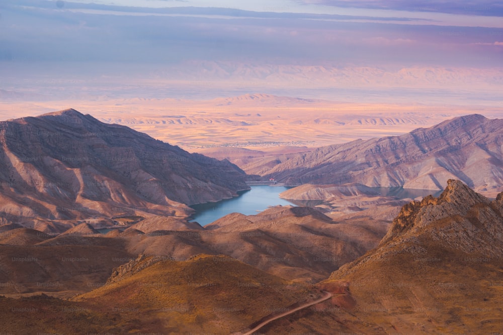 a mountain range with a lake in the middle