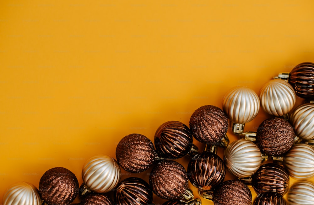 a group of christmas ornaments on a yellow background