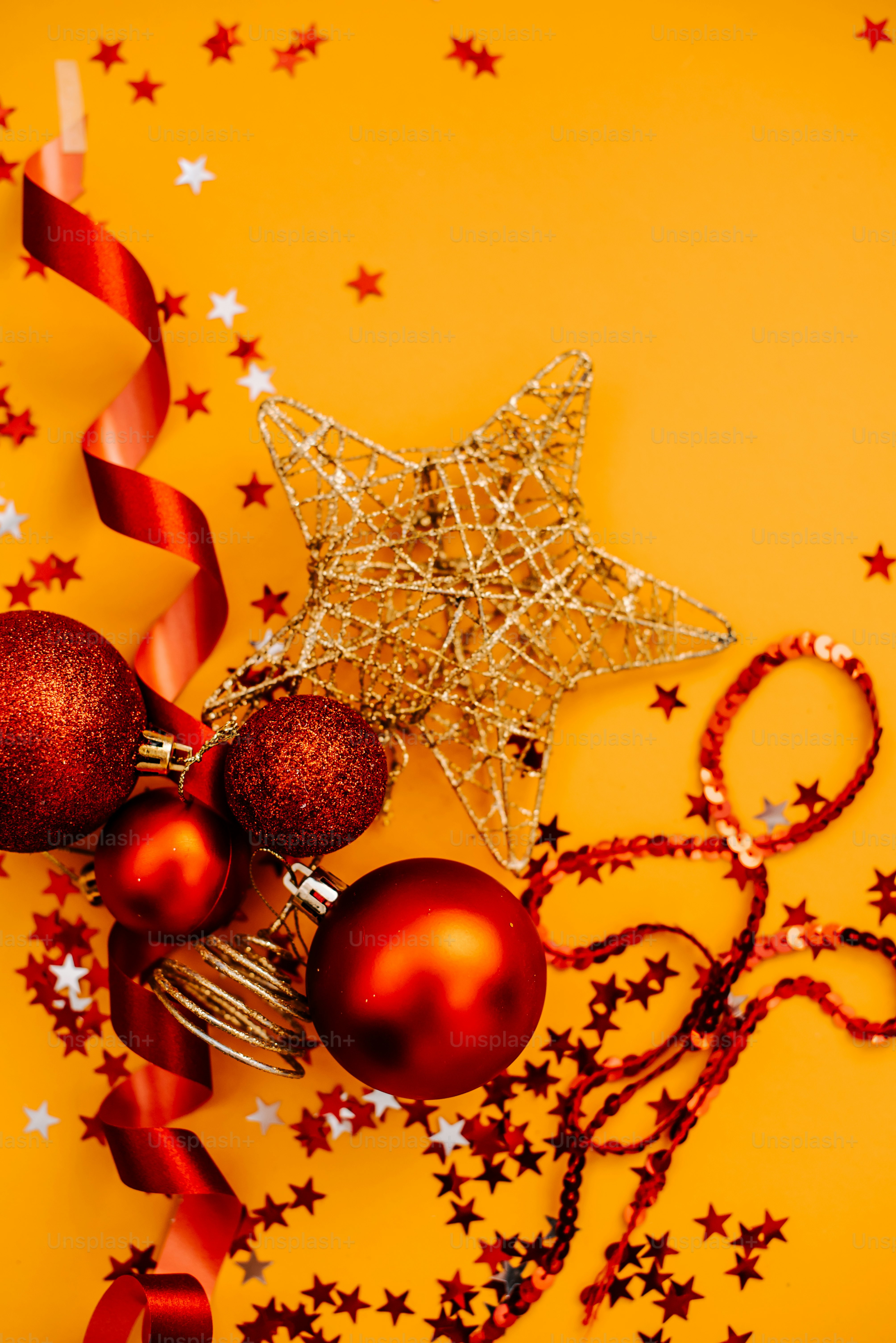 a yellow background with red ornaments and a star
