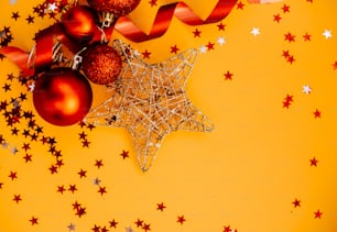 a yellow background with red and silver ornaments