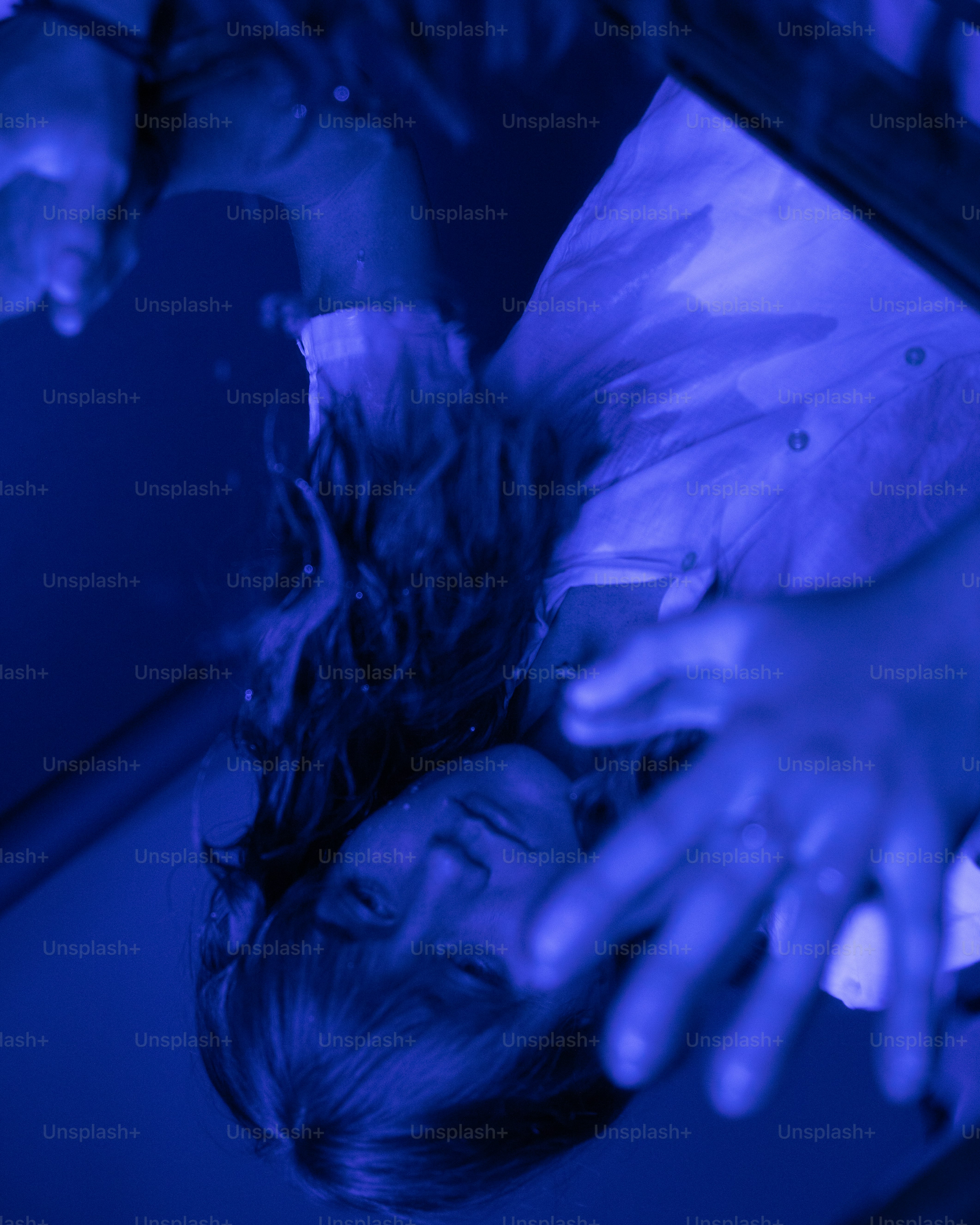 a woman laying on a bed in a room