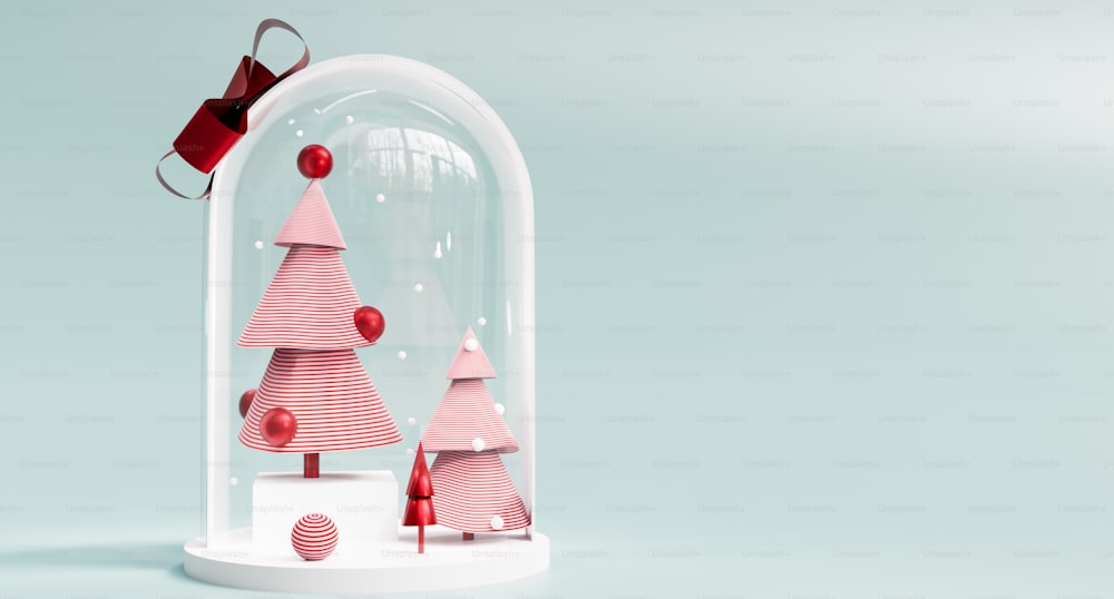 a glass dome with a red and white christmas tree under it