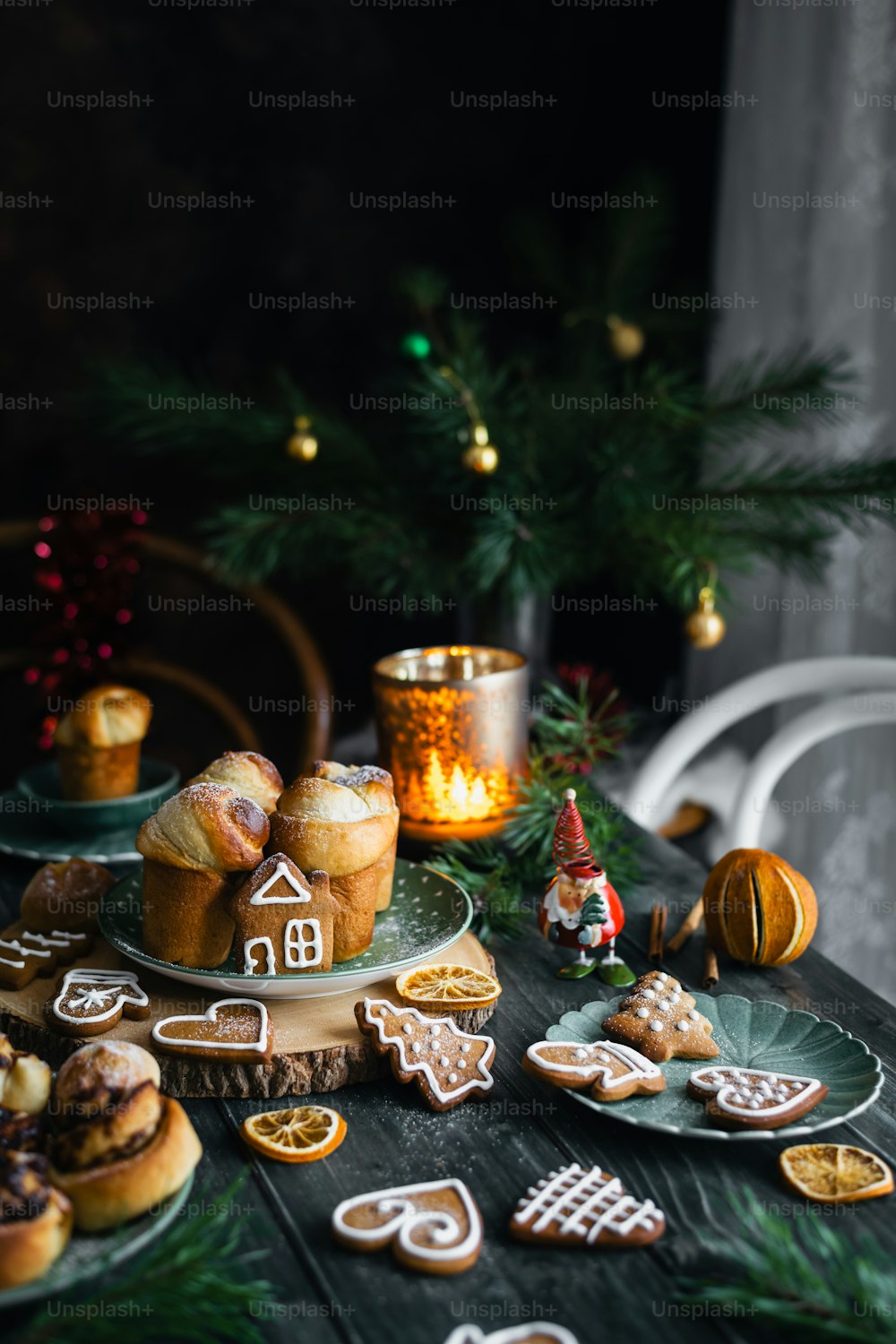 a table topped with lots of cookies and pastries