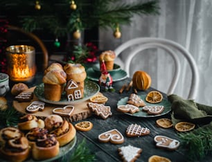 a table topped with lots of cookies and pastries