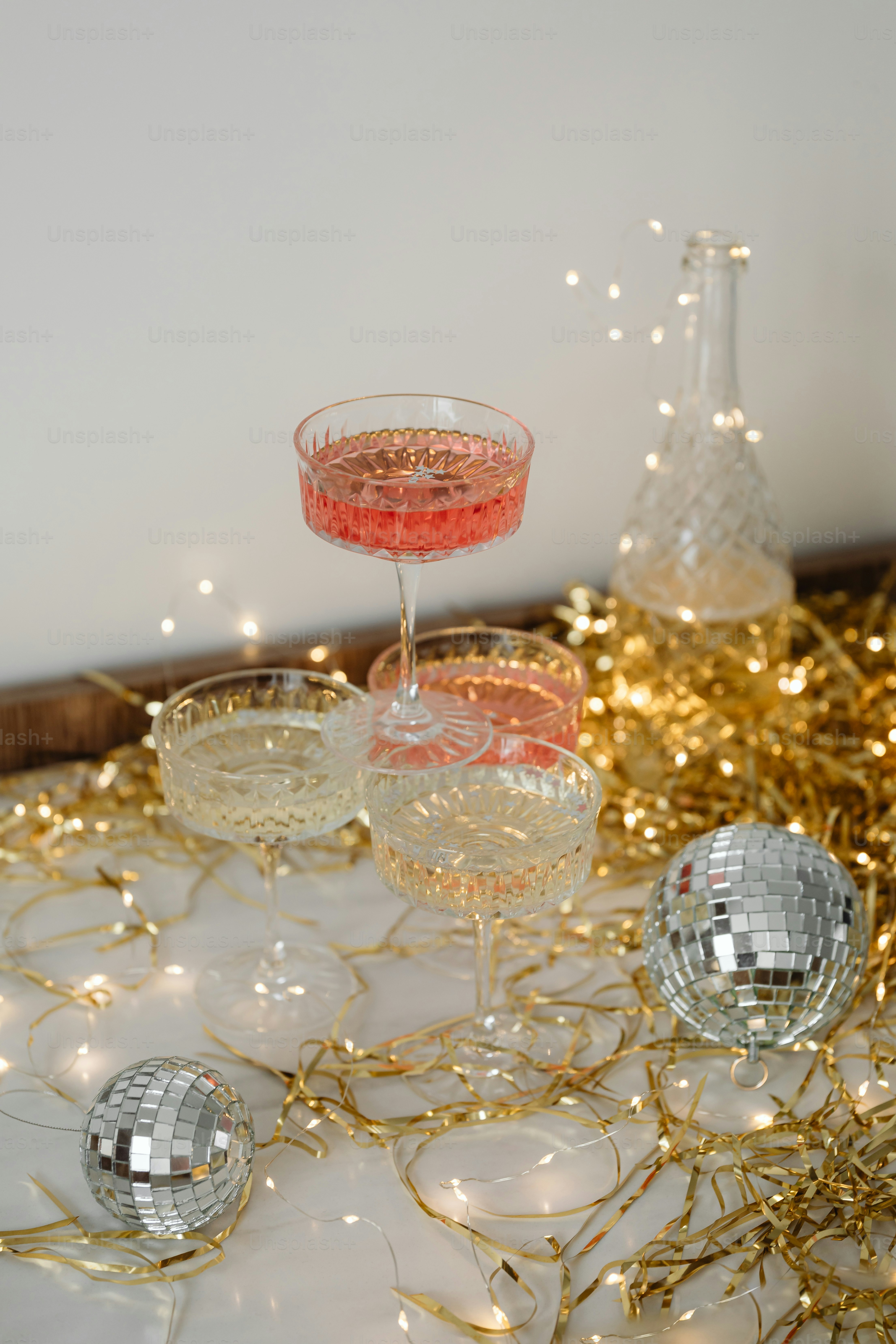 a table topped with glasses filled with liquid