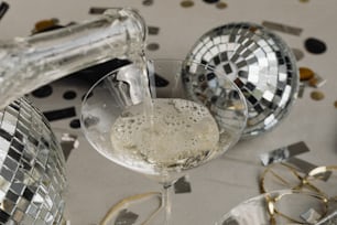 a glass of champagne being poured into a wine glass