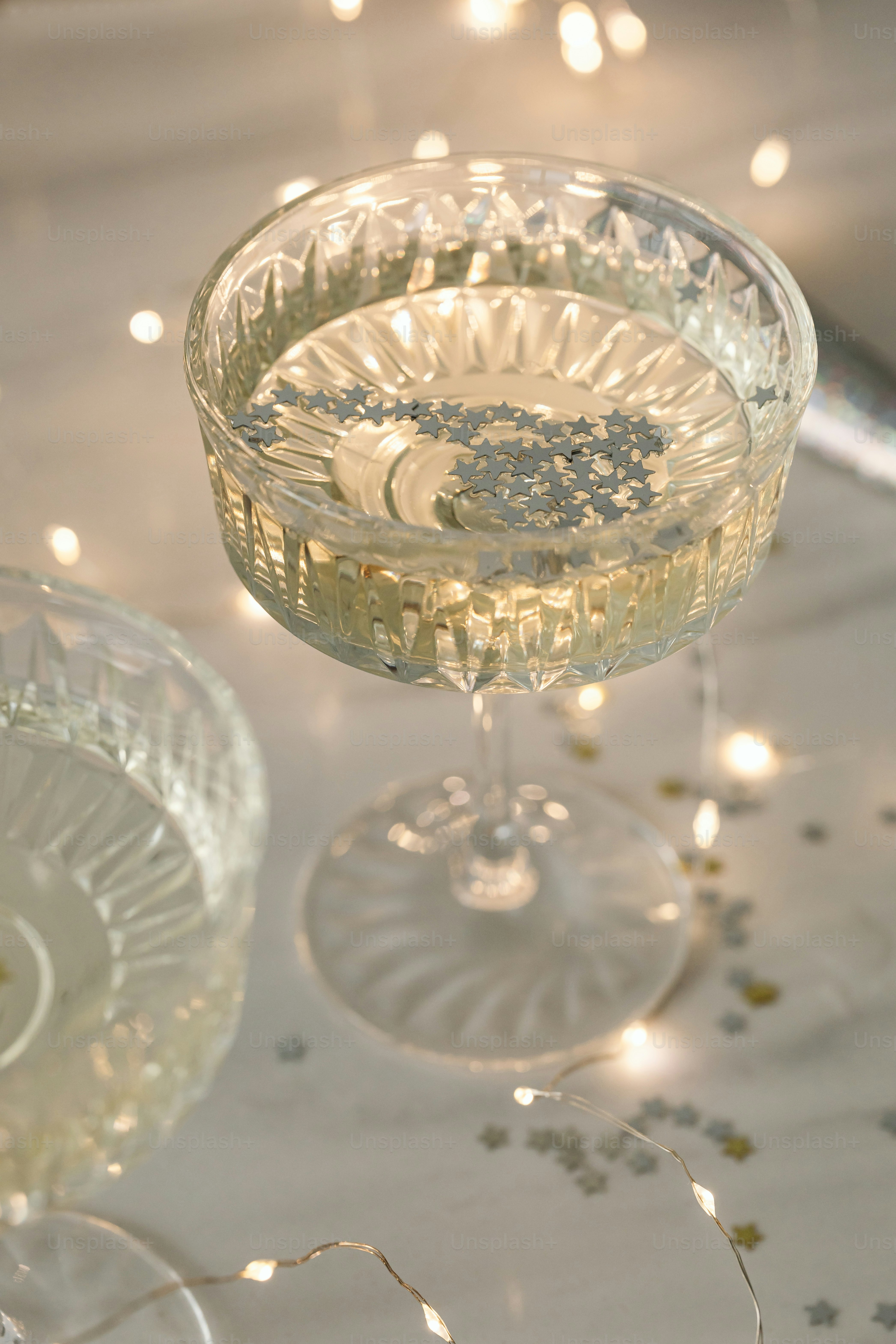 a close up of a wine glass on a table
