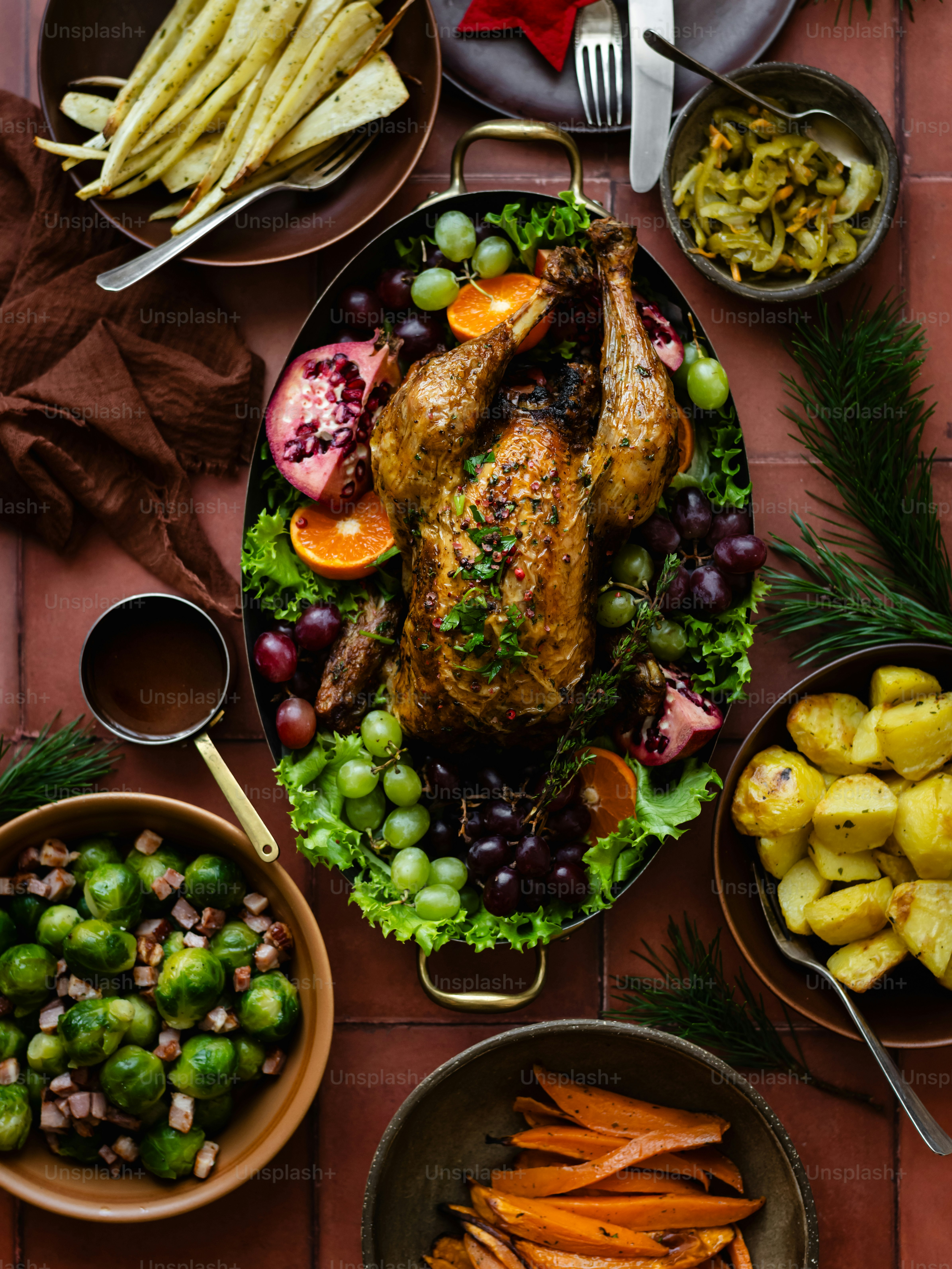 a table topped with plates of food and bowls of vegetables
