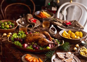 a table with a turkey, fruit, and cookies on it