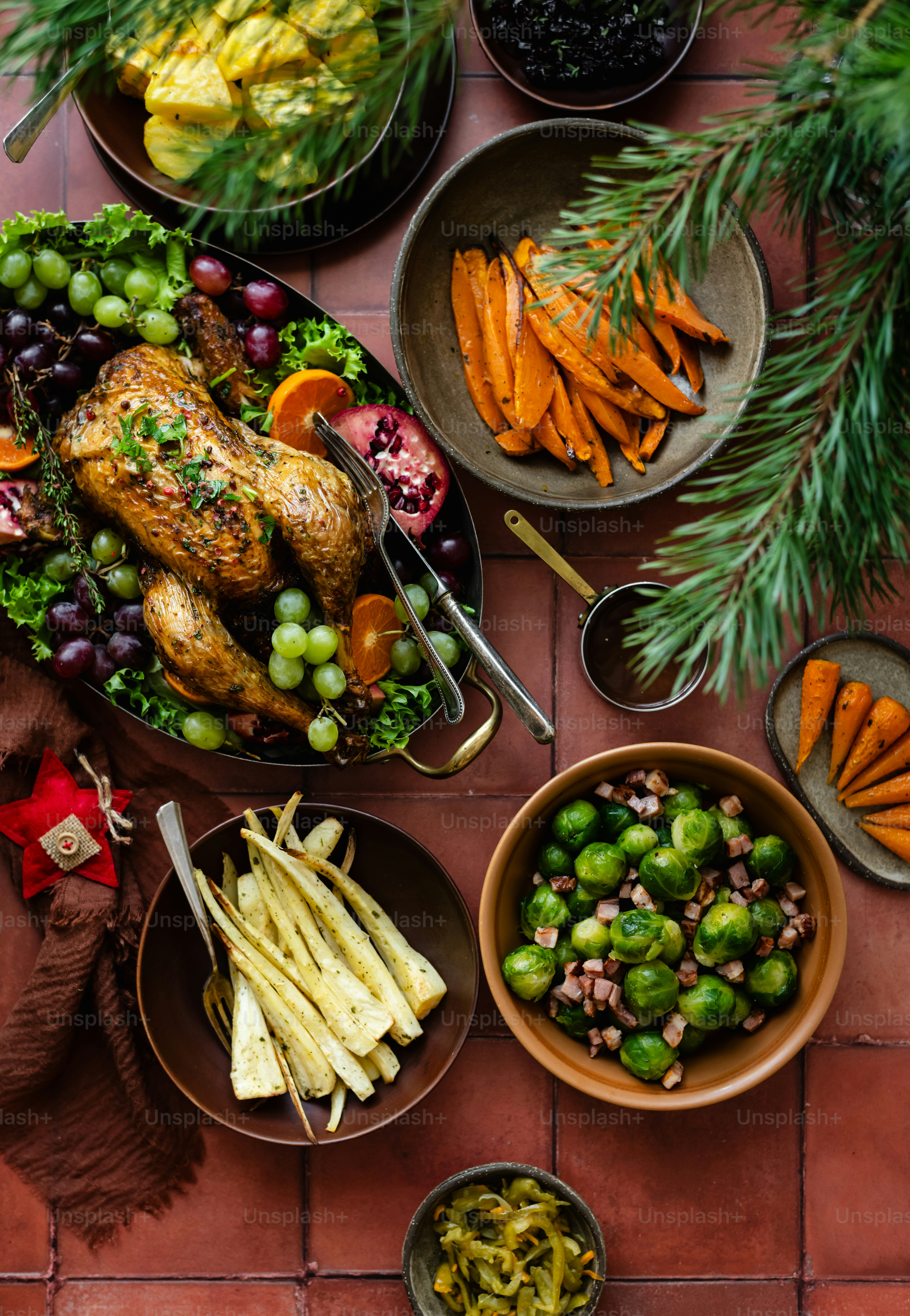 a table topped with plates of food and bowls of vegetables