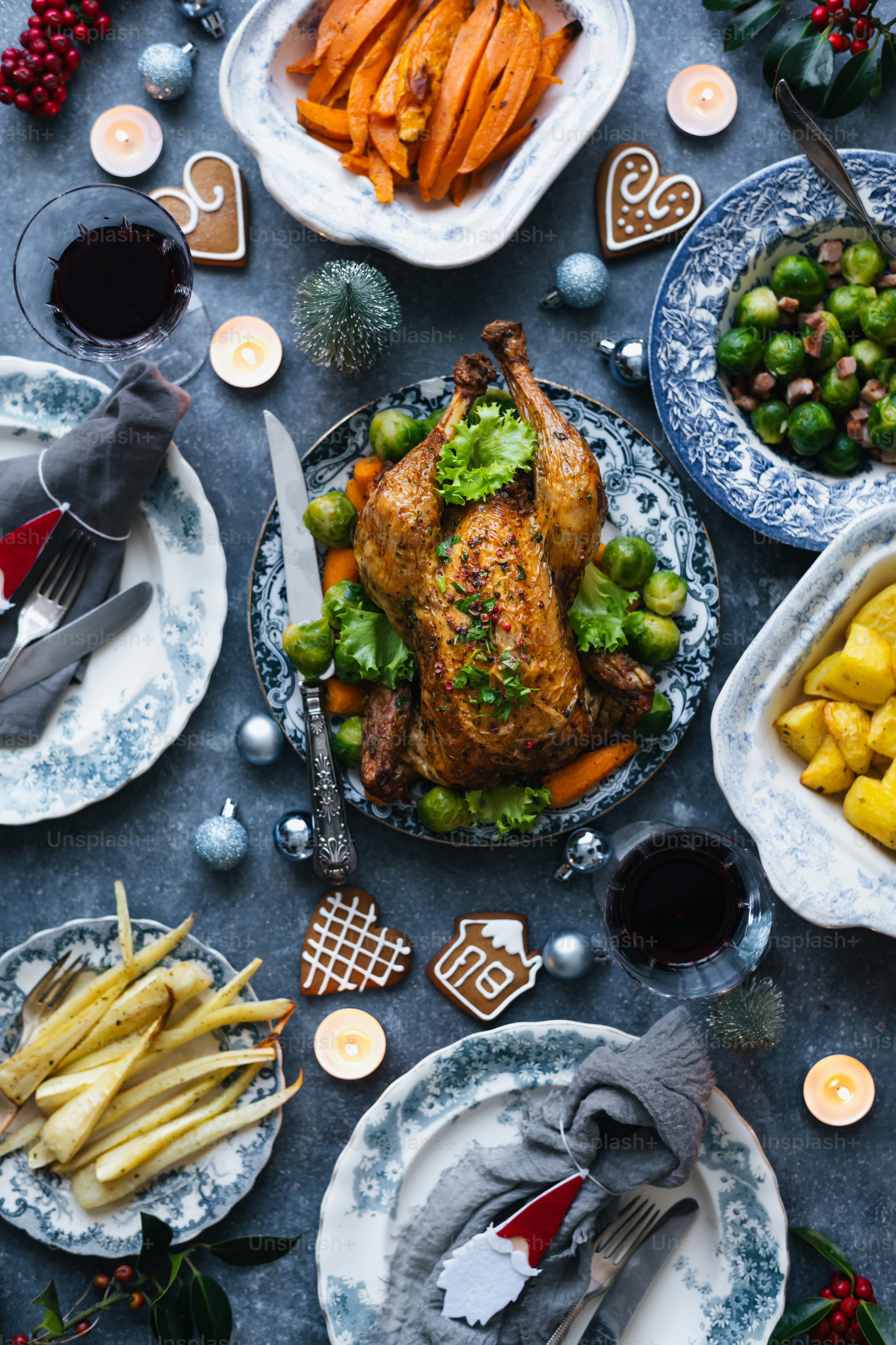 a table topped with plates of food and a turkey
