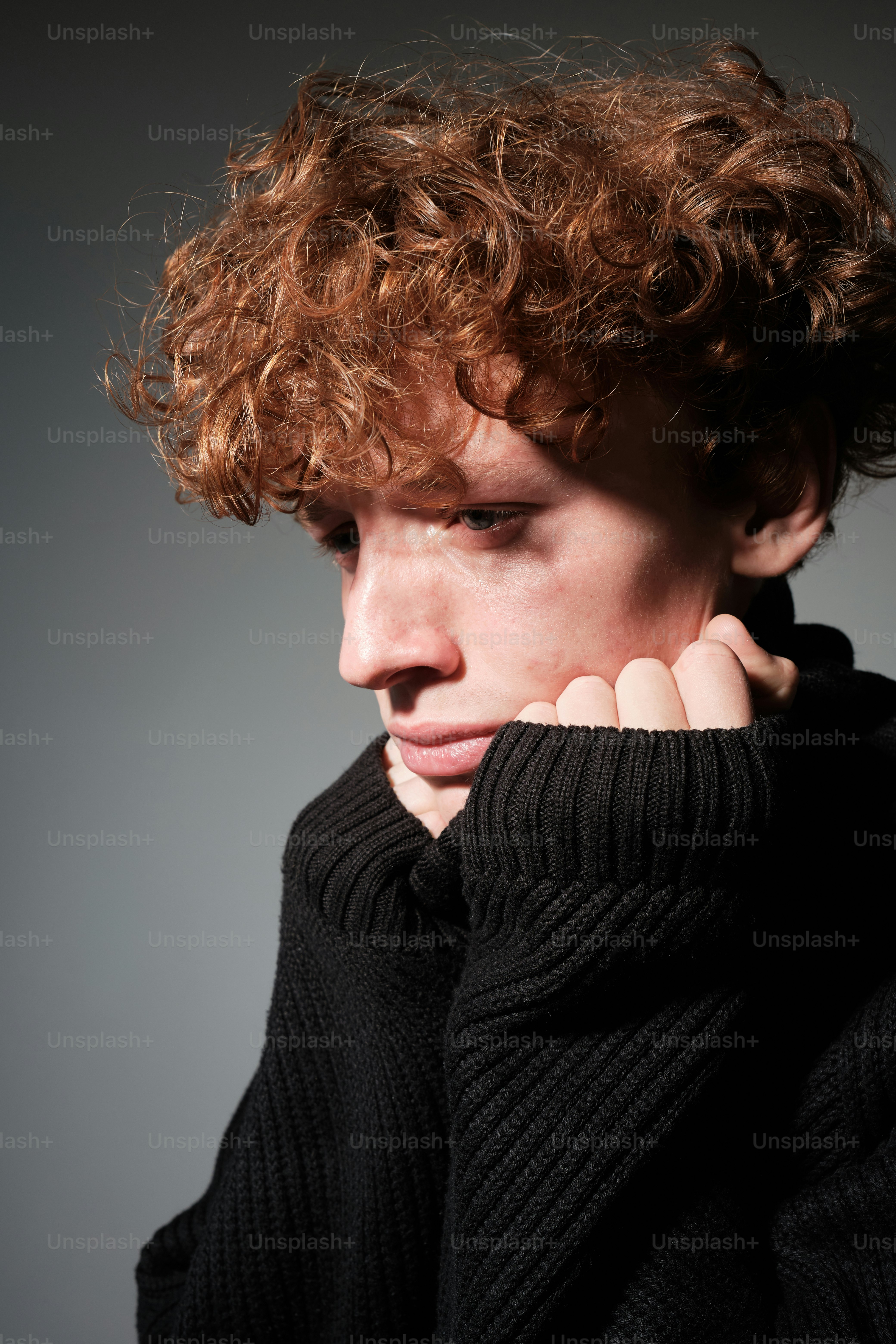 a close up of a person wearing a sweater