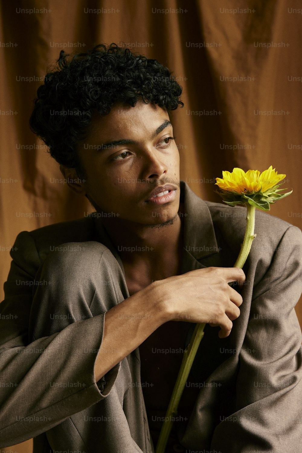 a man with a flower in his hand
