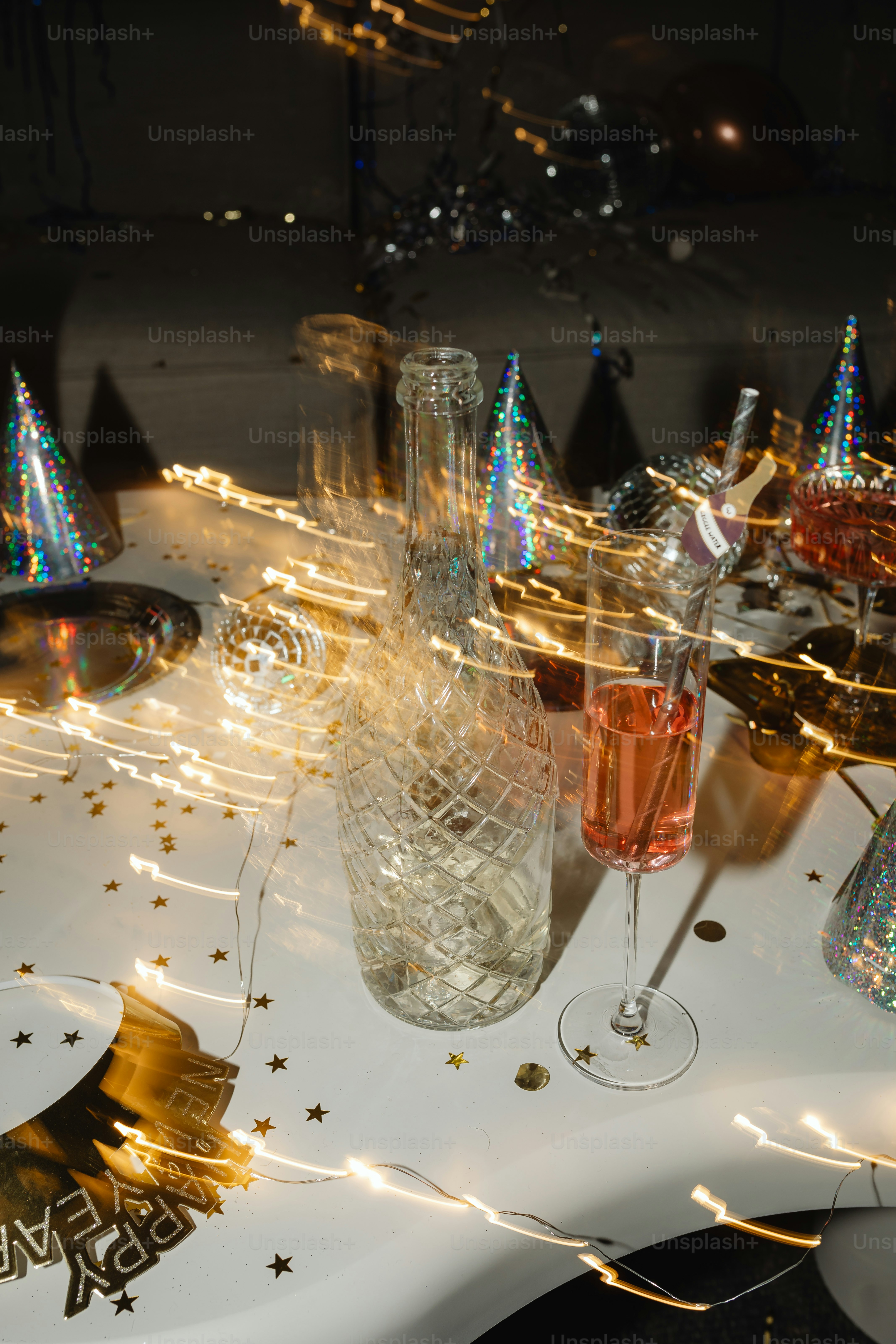 a white table topped with glasses filled with liquid